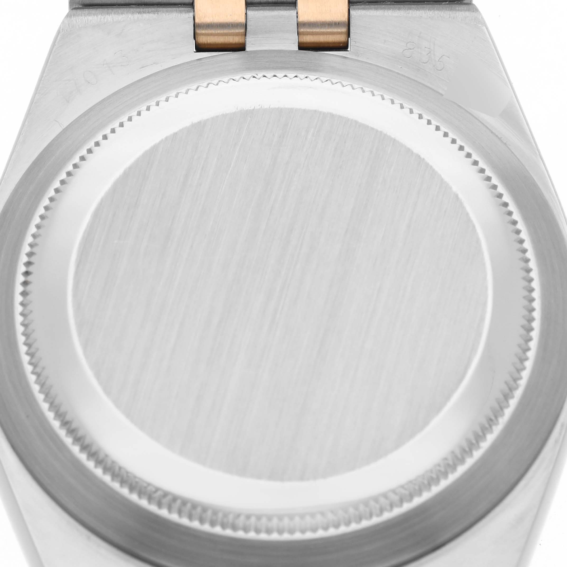 The image shows the case back of a Rolex Oysterquartz 17013 Men
s Steel and Gold (two tone) Silver Dial 17013 Men
s Steel and Gold (two tone) Silver Dial watch from a top-down perspective.
