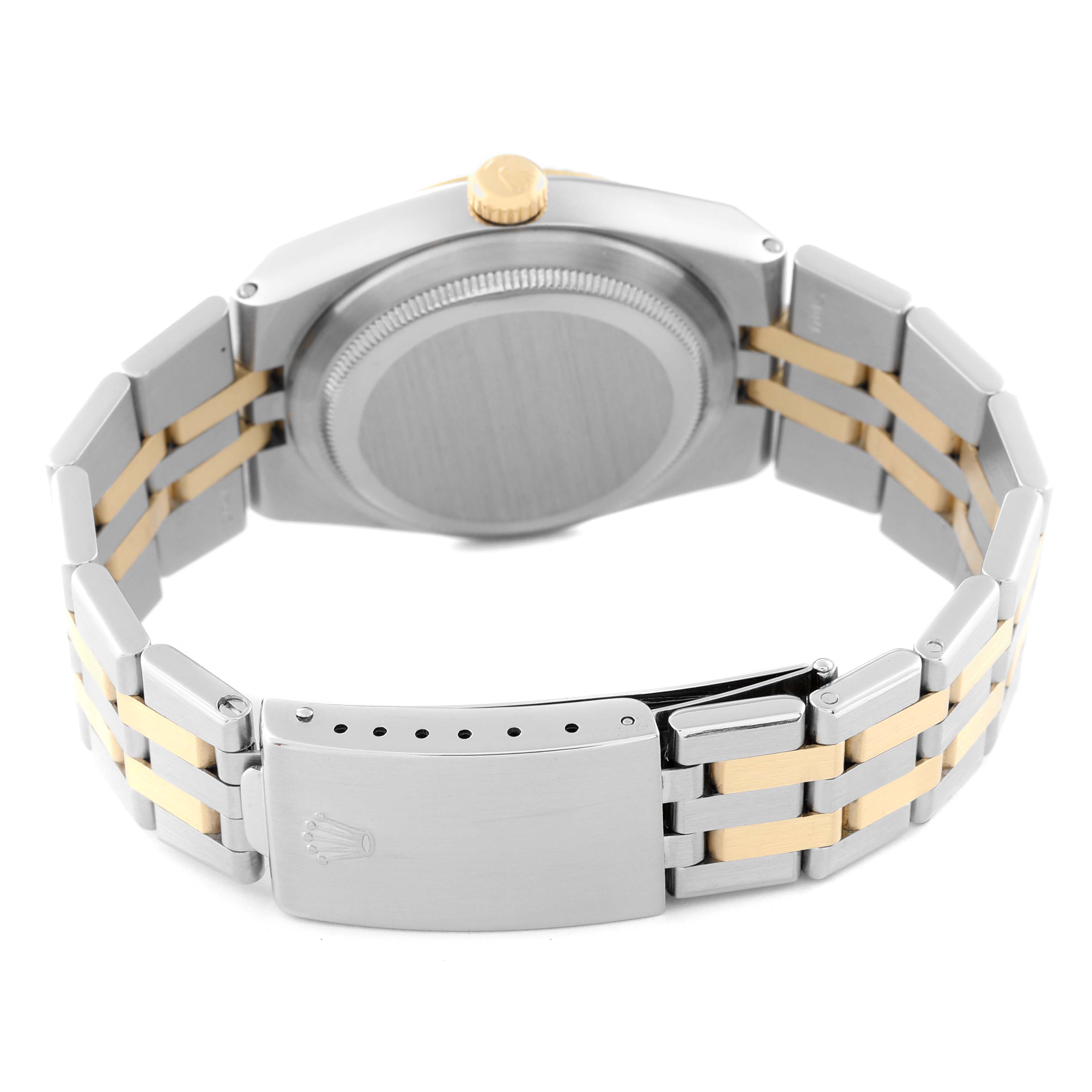 This image shows the back view of a Rolex Oysterquartz 17013 Men
s Steel and Gold (two tone) White Dial 17013 Men
s Steel and Gold (two tone) White Dial watch, highlighting the case, crown, and two-tone bracelet with clasp.