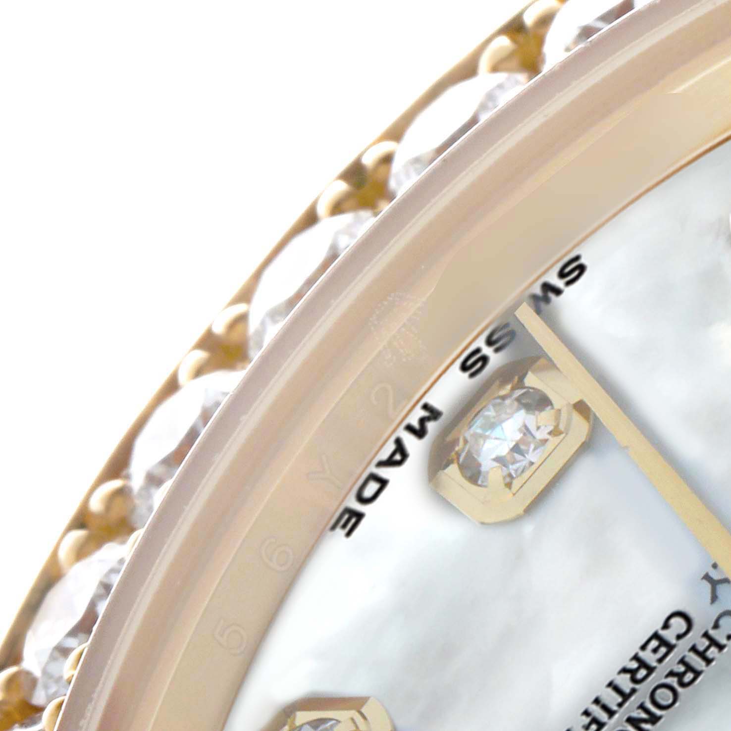 The image shows a close-up of the Rolex Pearlmaster 81298 Women
s Yellow Gold Mother of Pearl Dial watch
s bezel and part of the dial, displaying its gem-set design.