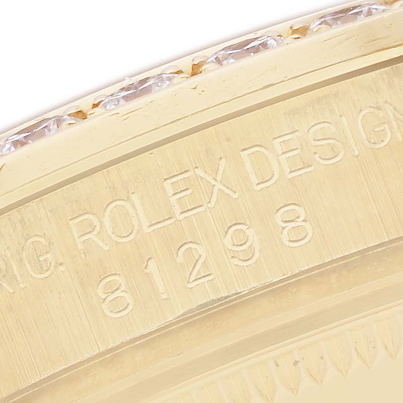 The image shows a close-up of the engraved side of a Rolex Pearlmaster 81298 Women
s Yellow Gold Mother of Pearl Dial watch, highlighting its model number and design details.