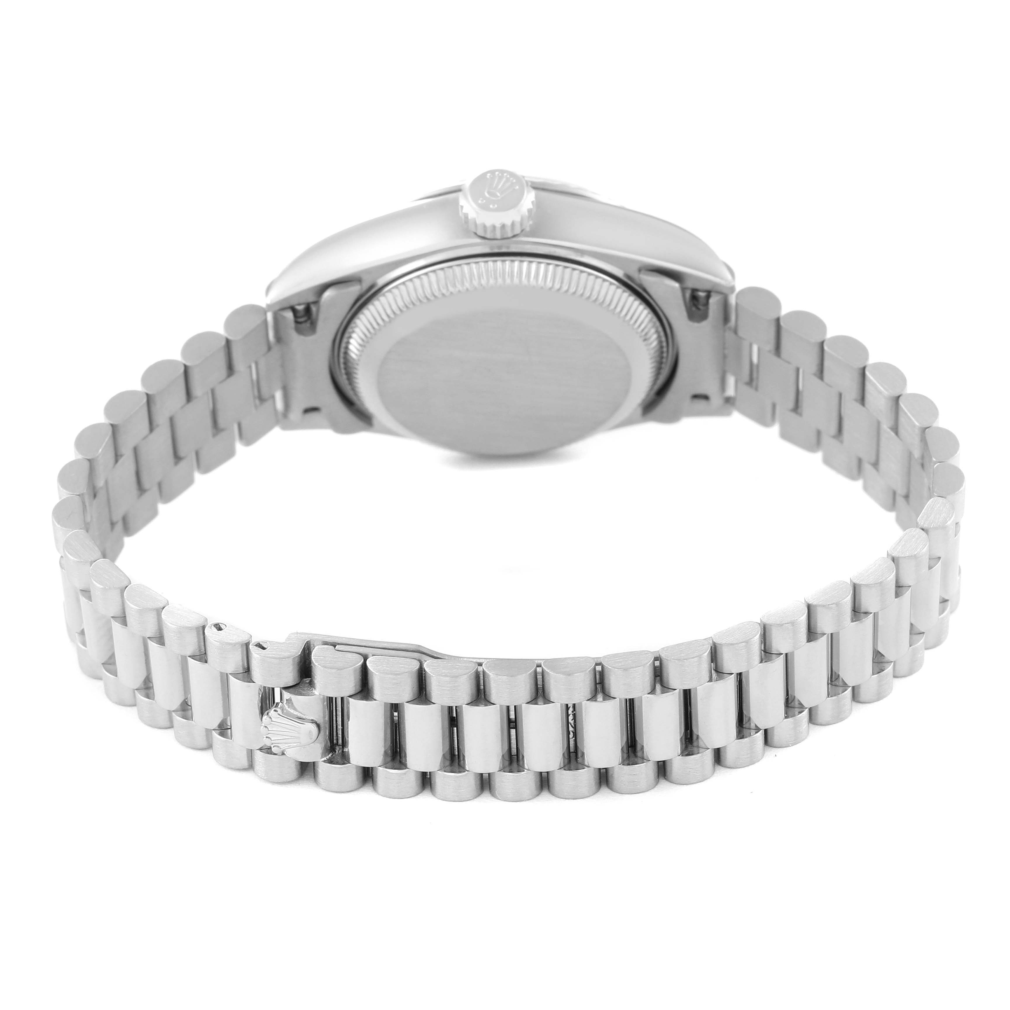 The image shows the back view of a Rolex President 69179 Women
s White Gold Silver Dial 69179 Women
s White Gold Silver Dial model watch, highlighting its case back and bracelet.