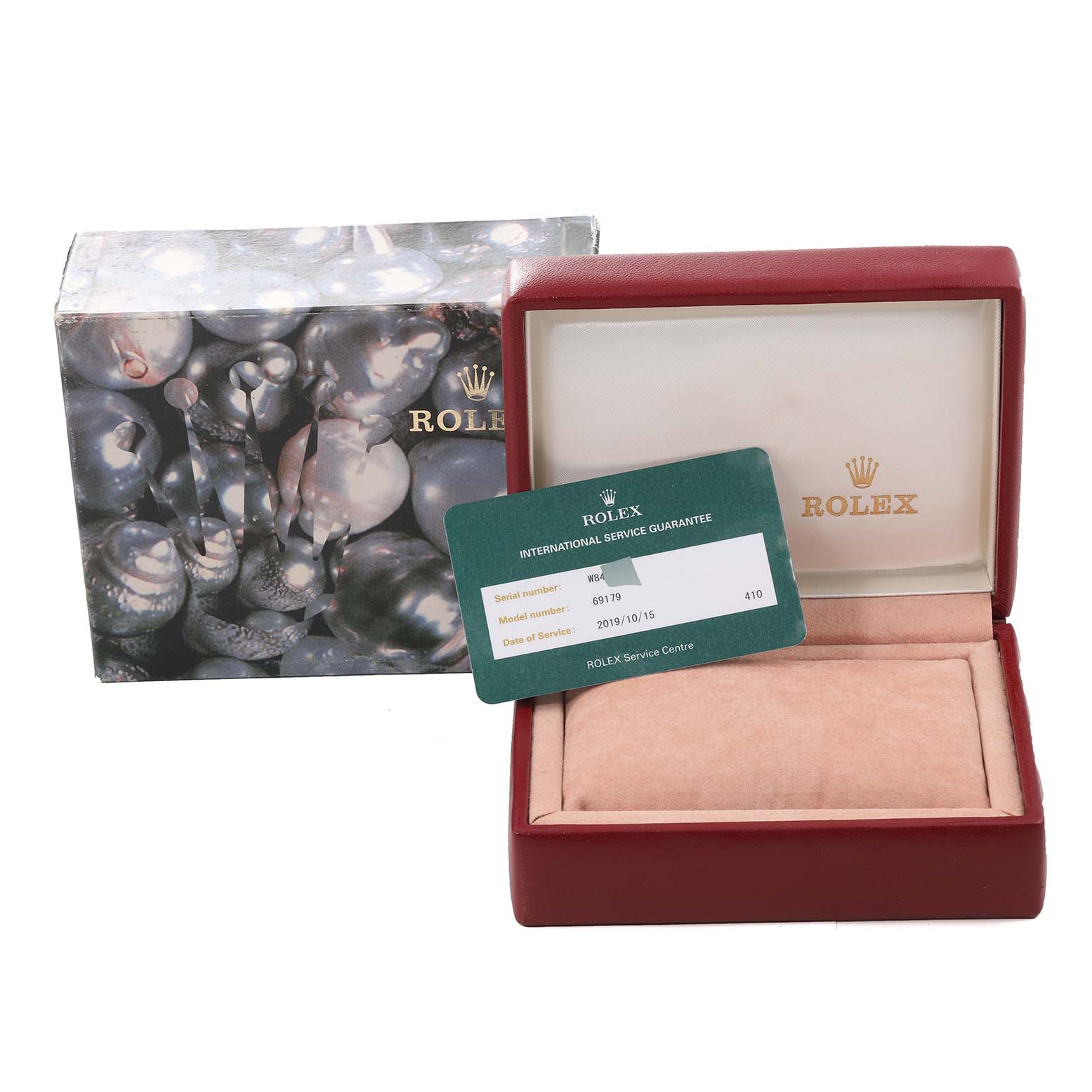 The image shows a Rolex President 69179 Women
s White Gold Silver Dial 69179 Women
s White Gold Silver Dial model watch box, an outer box, and an international service guarantee card.