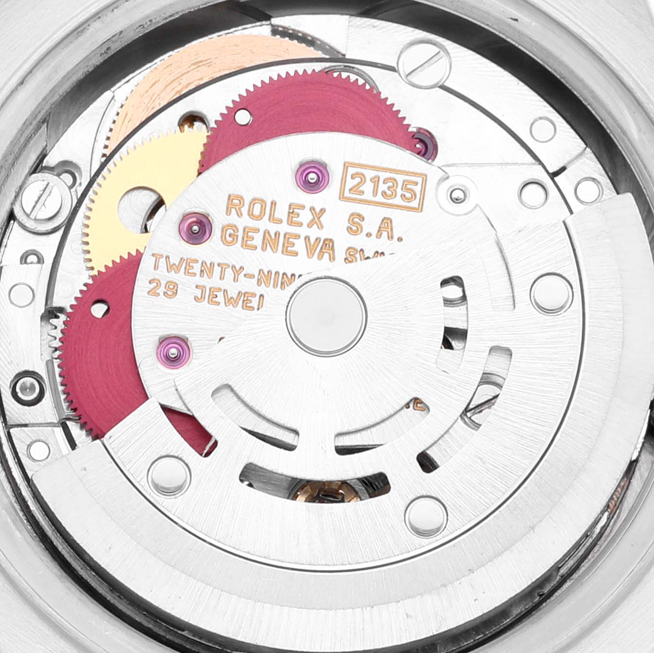This image shows a close-up of the movement mechanism of the Rolex President 69179 Women
s White Gold Silver Dial 69179 Women
s White Gold Silver Dial model watch, highlighting gears and the rotor.