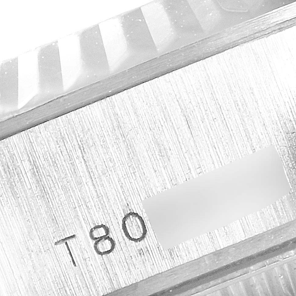 This close-up image shows the bezel and the serial number engraving of a Rolex President 69179 Women's White Gold Silver Dial 69179 Women's White Gold Silver Dial model watch.