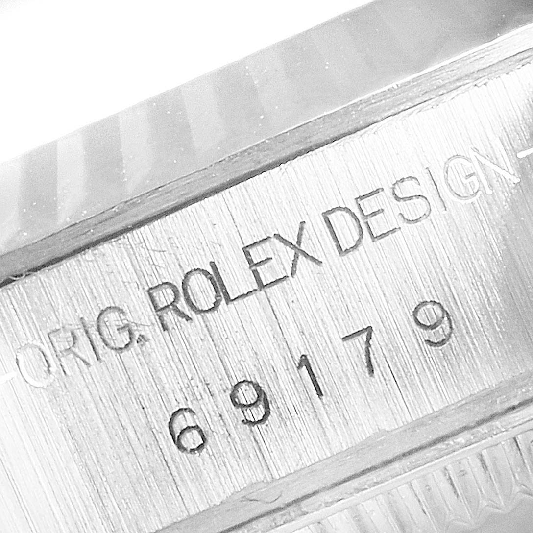 This image shows a close-up of the engraved model number and design information on the case of a Rolex President 69179 Women's White Gold Silver Dial 69179 Women's White Gold Silver Dial watch.