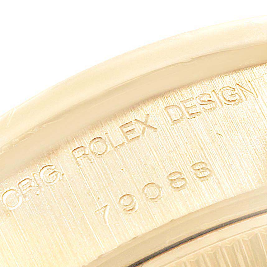 This image shows a close-up of the engraved case back edge on a Rolex President 79088 Women
s Yellow Gold Silver Dial 79088 Women
s Yellow Gold Silver Dial model watch.
