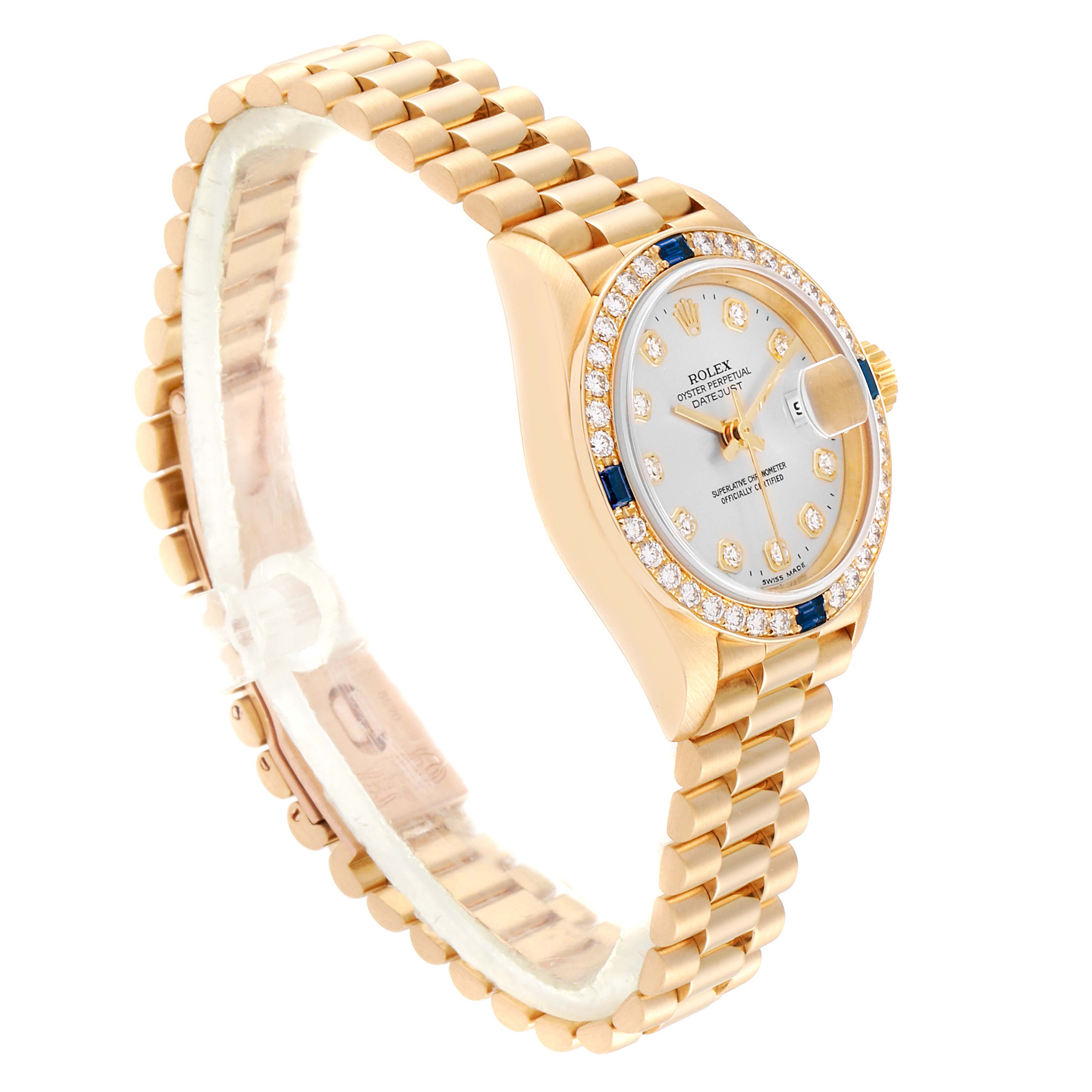 This image shows a side and partial top view of a Rolex President 79088 Women
s Yellow Gold Silver Dial 79088 Women
s Yellow Gold Silver Dial model watch, highlighting its gold bracelet and jeweled bezel.