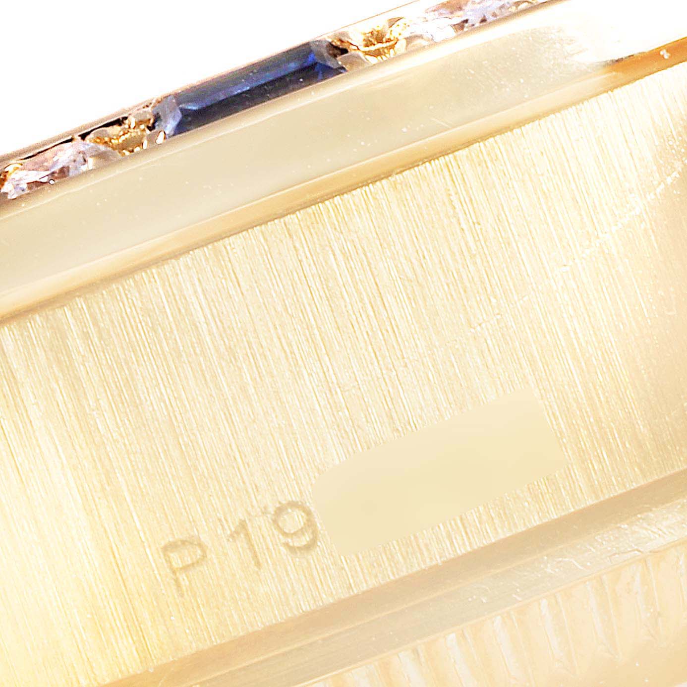 The image shows a close-up of the casing edge and engraved serial number of a Rolex President 79088 Women
s Yellow Gold Silver Dial 79088 Women
s Yellow Gold Silver Dial model watch.