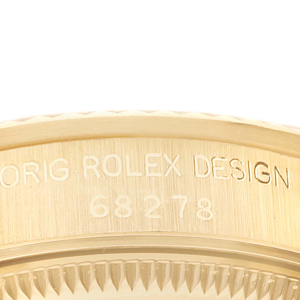 The image shows a close-up side view of the casing for the Rolex President 68278 Women's Yellow Gold Champagne Dial 68278 Women's Yellow Gold Champagne Dial model, highlighting the engraved design number.