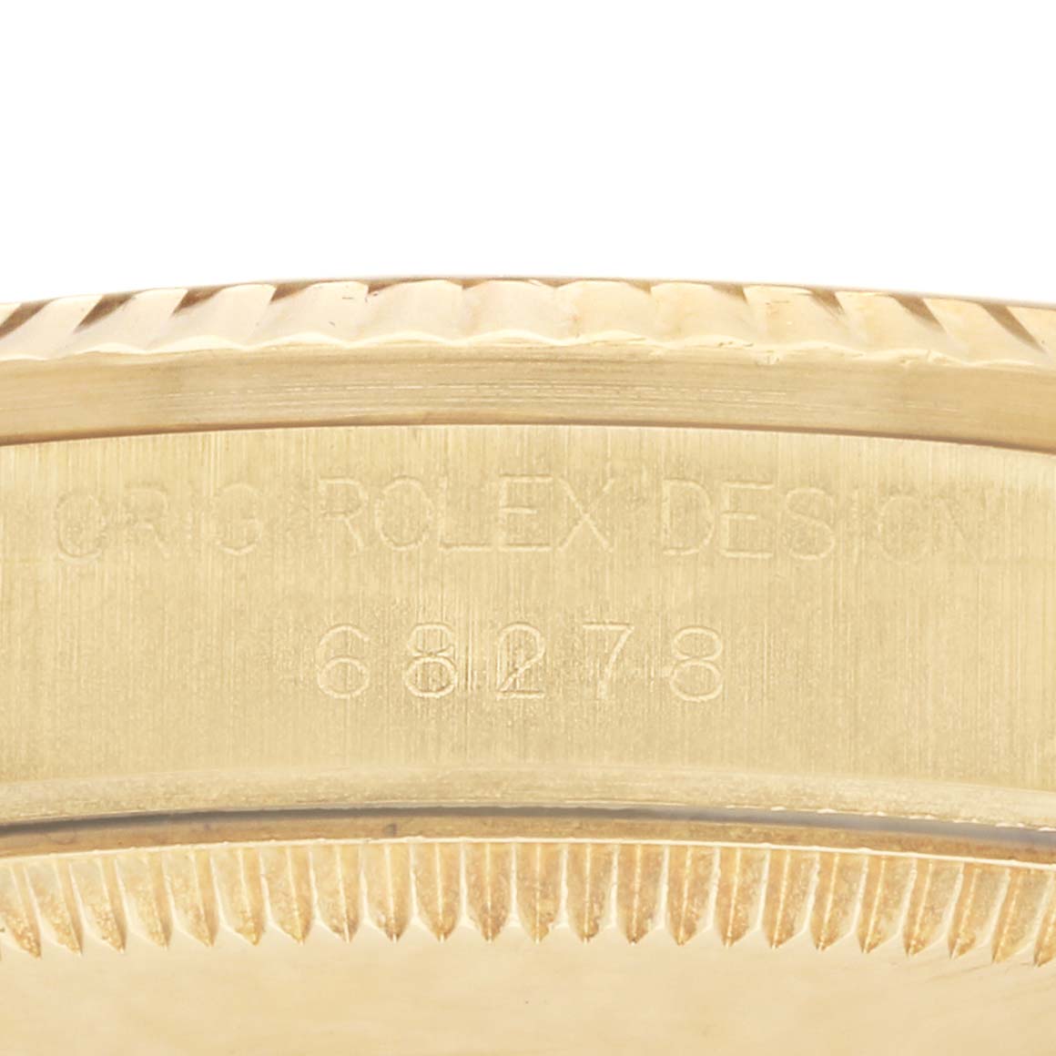 The image shows a close-up of the engraving on the side of a Rolex President 68278 Women
s Yellow Gold Mother of Pearl Dial watch, displaying the model number.