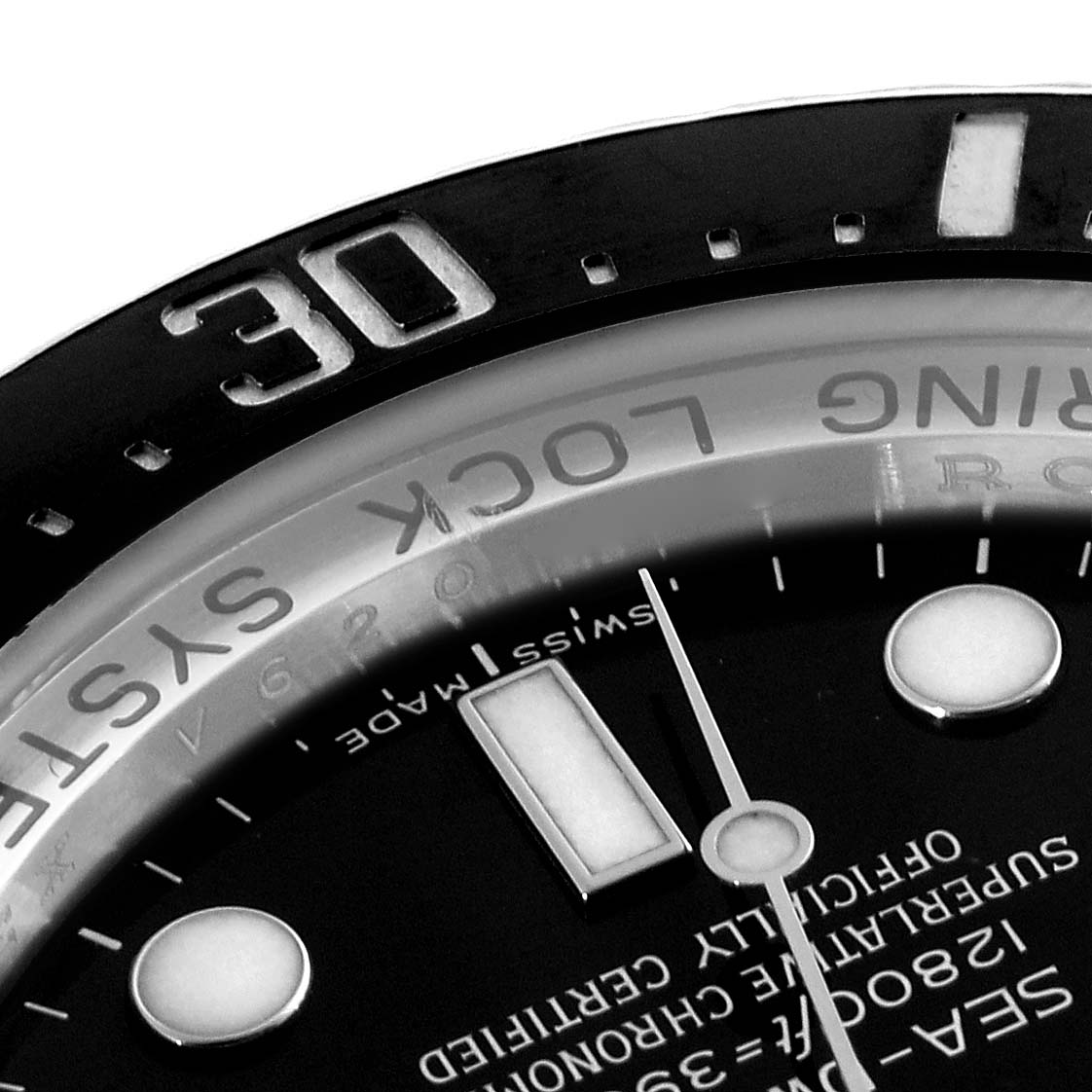 The image shows a close-up of the Rolex Sea-Dweller 116660 Men's Stainless Steel Black Dial watch bezel and part of the dial, highlighting the "Swiss Made" text and minute markers.