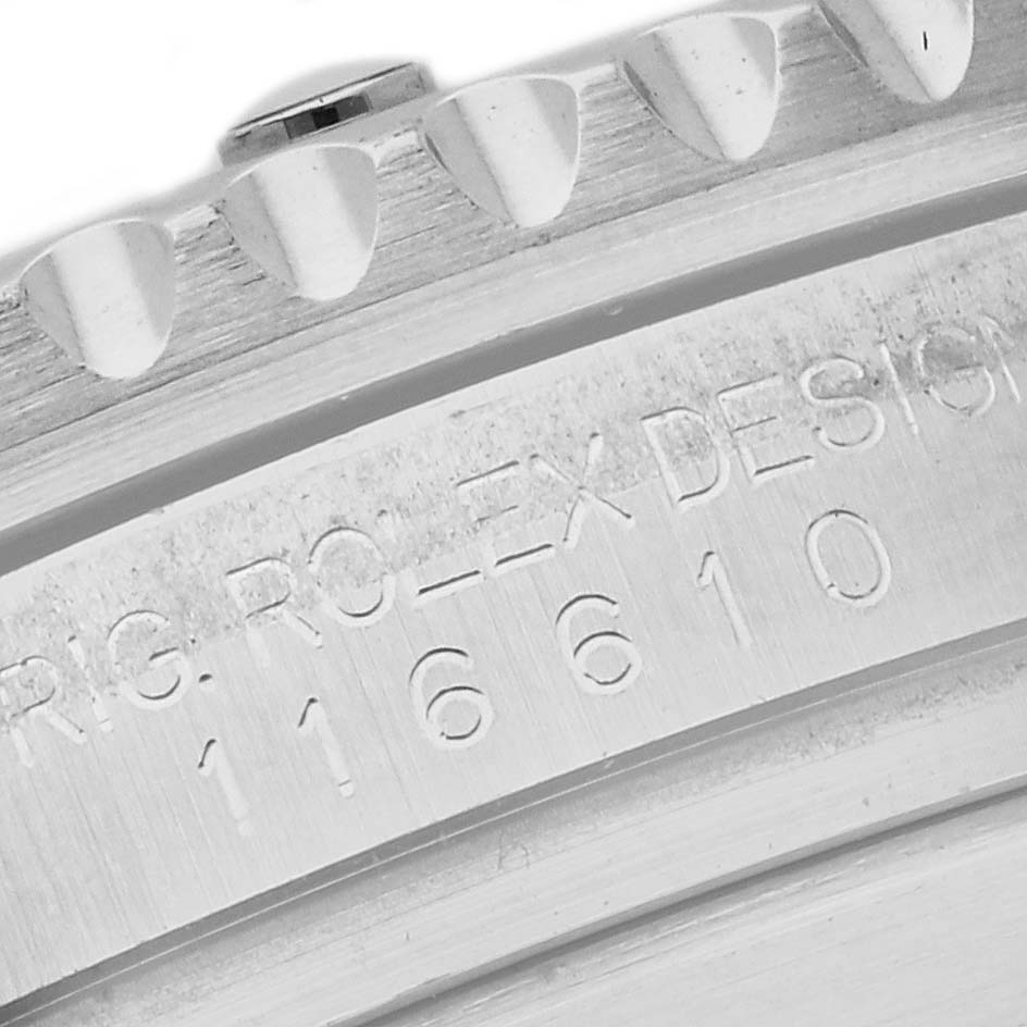 This image shows a close-up of the bezel and serial number engraving on a Rolex Submariner 116610 Men
s Stainless Steel Black Dial 116610 Men
s Stainless Steel Black Dial watch.