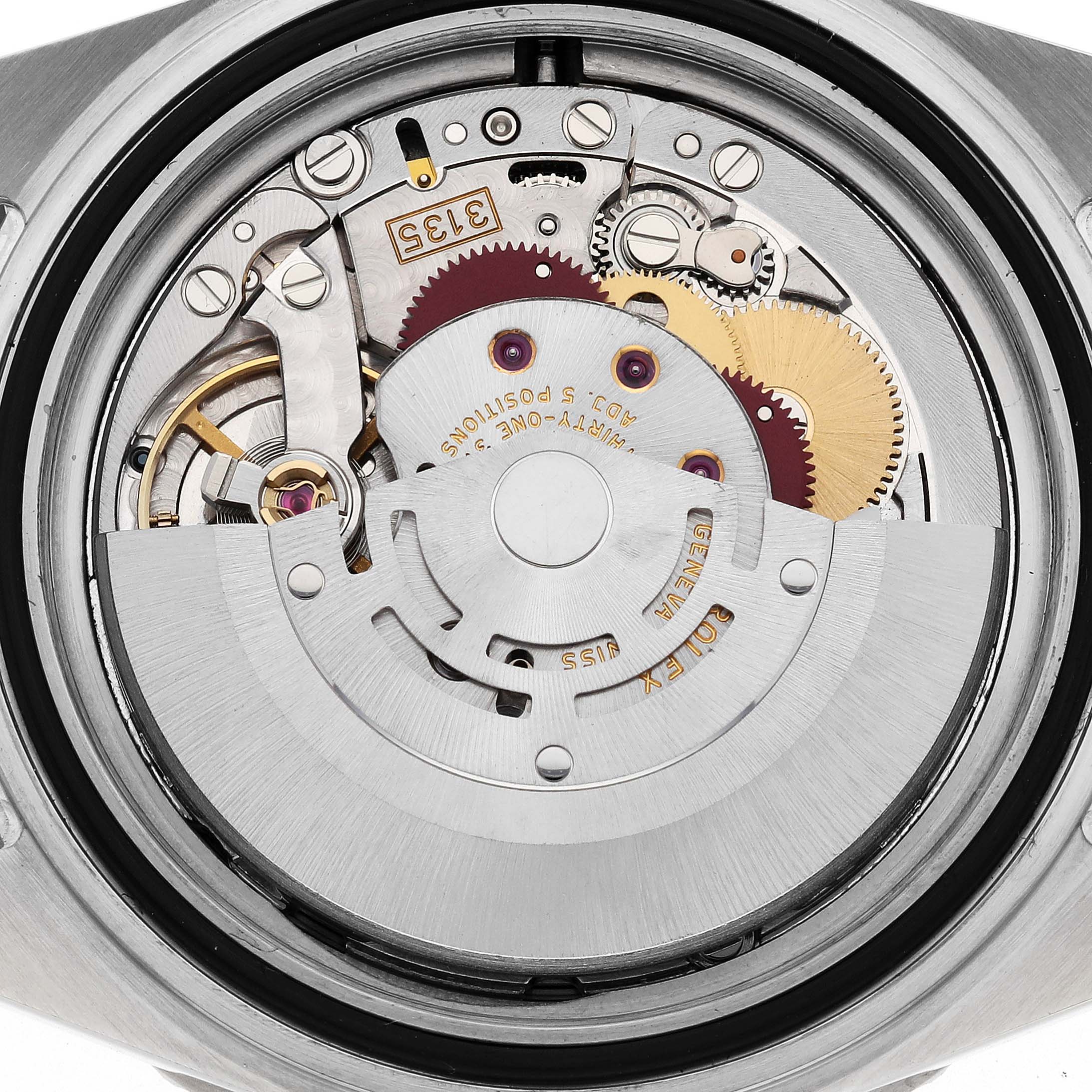 This is a close-up view of the open case back showing the movement and internal components of a Rolex Submariner 16610 Men
s Stainless Steel Black Dial 16610 Men
s Stainless Steel Black Dial watch.