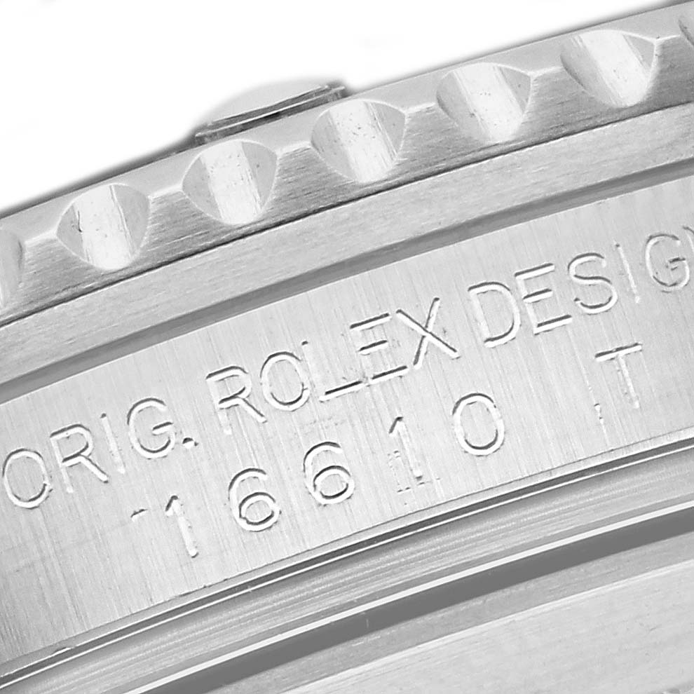 The image shows a close-up of the case side of a Rolex Submariner 16610 Men
s Stainless Steel Black Dial 16610 Men
s Stainless Steel Black Dial, displaying the engraved model number "16610."