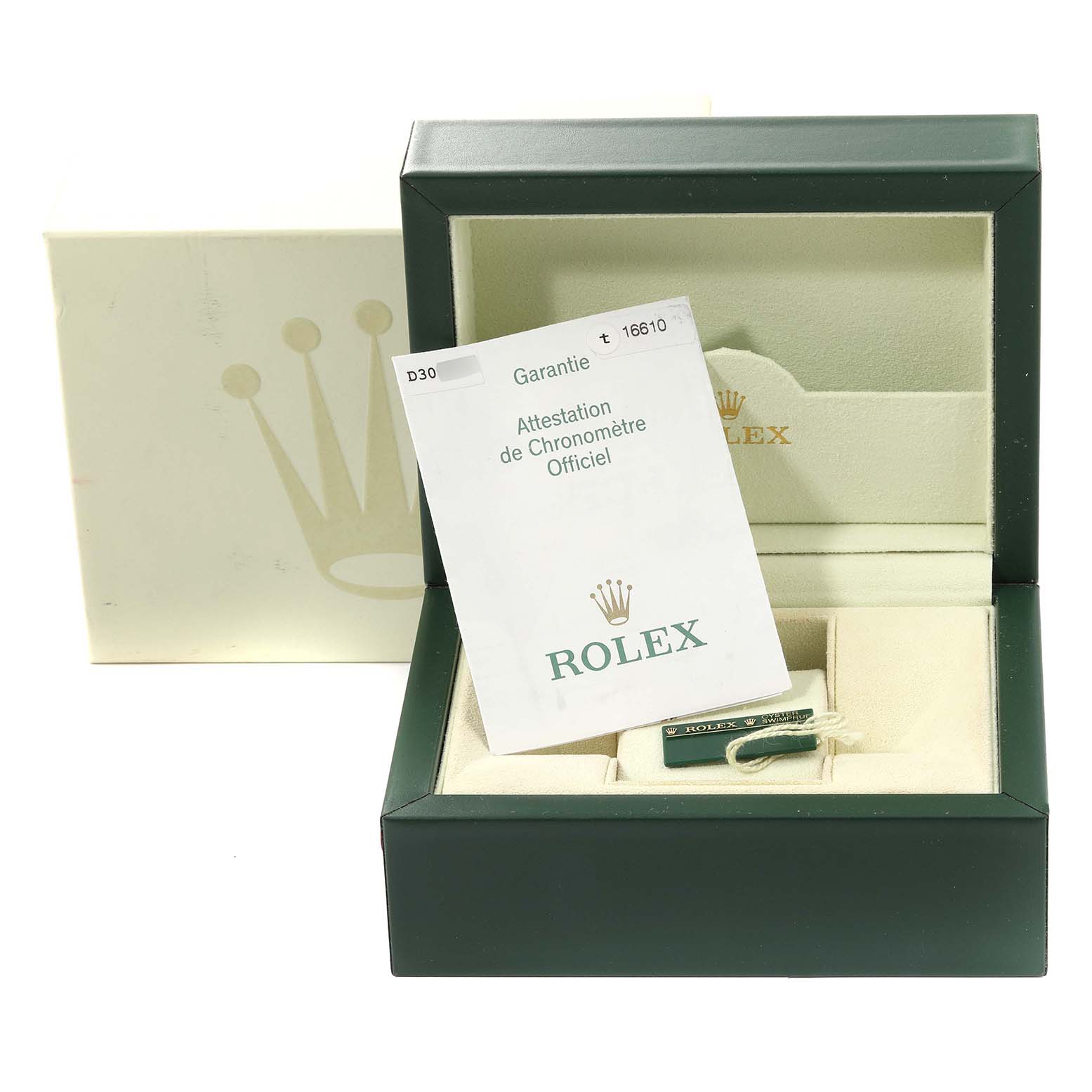 The image shows the open box of a Rolex Submariner 16610 Men
s Stainless Steel Black Dial 16610 Men
s Stainless Steel Black Dial with warranty papers and a tag inside.