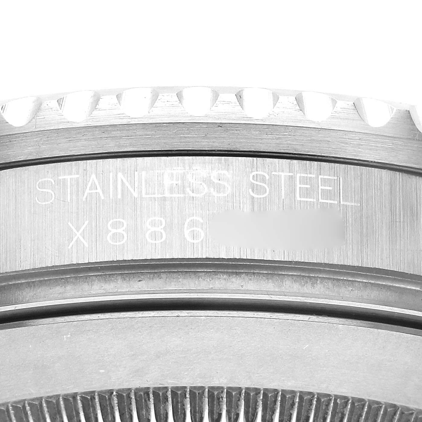 The image shows a close-up of the case side of a Rolex Submariner 116610 Men
s Stainless Steel Black Dial, highlighting the stainless steel and partial serial number engraving.