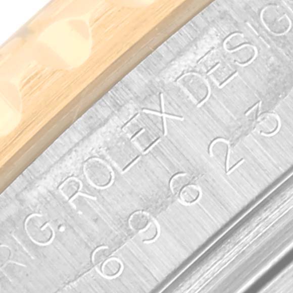 The image shows a close-up of the side engraving on a Rolex Yacht-Master 69623 Women's Steel and Gold (two tone) White Dial 69623 Women's Steel and Gold (two tone) White Dial watch case.