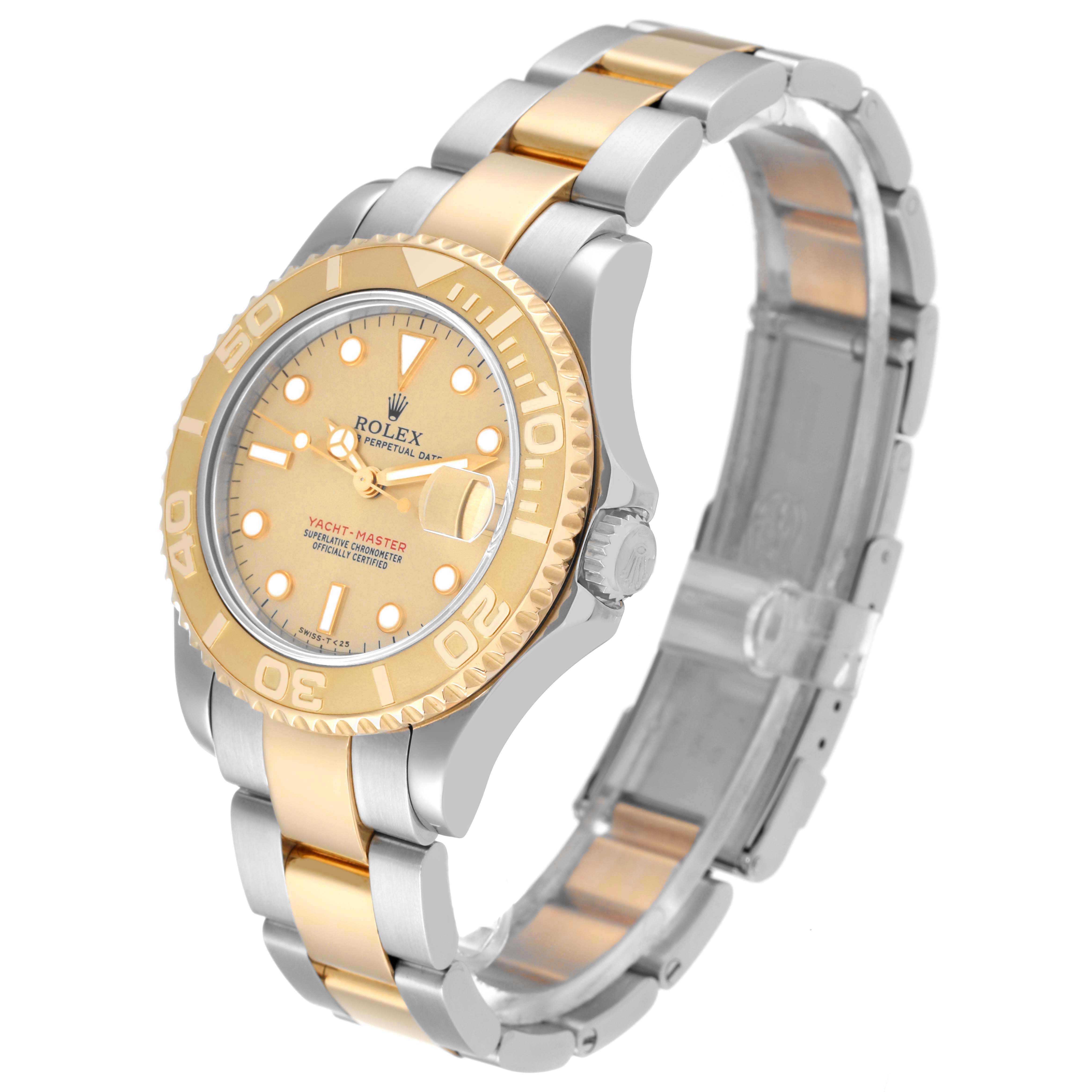 The Rolex Yacht-Master 68623 Men
s Steel and Gold (two tone) Champagne Dial 68623 Men
s Steel and Gold (two tone) Champagne Dial watch is shown at a three-quarter angle, highlighting its gold and silver two-tone design, bezel, and bracelet.