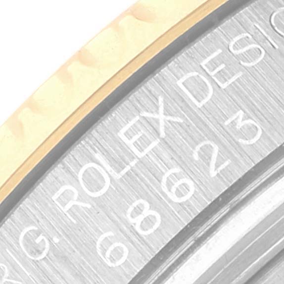 The image is a close-up of the bezel and part of the case of the Rolex Yacht-Master 68623 Men
s Steel and Gold (two tone) Champagne Dial 68623 Men
s Steel and Gold (two tone) Champagne Dial watch.