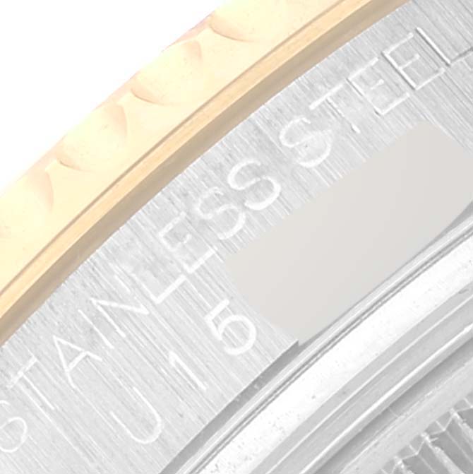 The image shows a close-up of the case back and part of the bezel of the Rolex Yacht-Master 68623 Men
s Steel and Gold (two tone) Champagne Dial 68623 Men
s Steel and Gold (two tone) Champagne Dial watch.