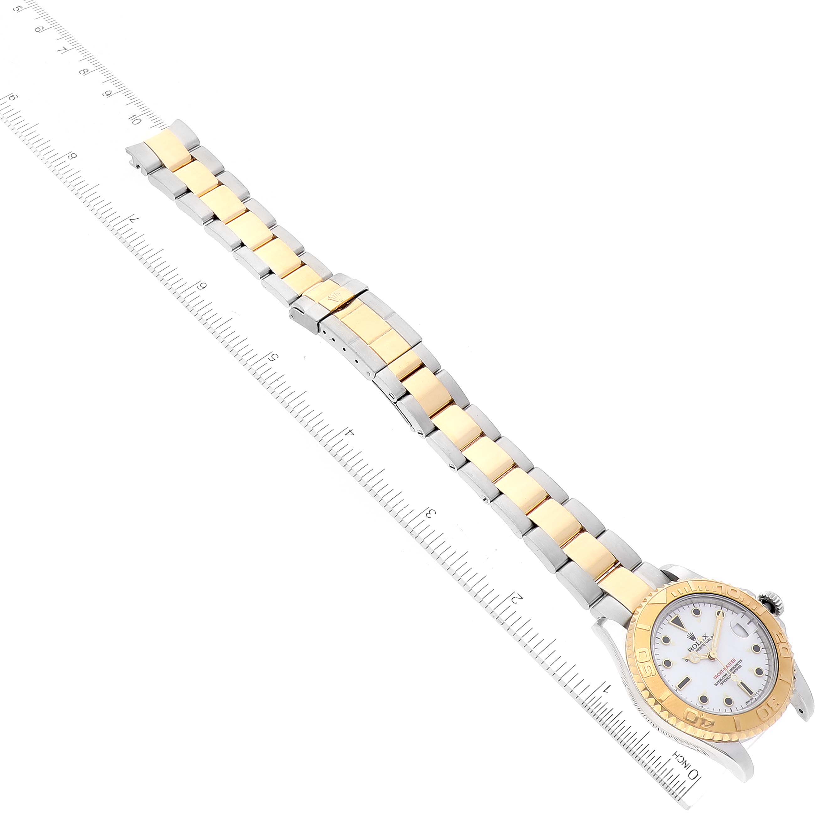 This image shows a Rolex Yacht-Master 68623 Men's Steel and Gold (two tone) White Dial 68623 Men's Steel and Gold (two tone) White Dial watch, displaying its full length bracelet and face, taken from an overhead angle with a ruler for scale.