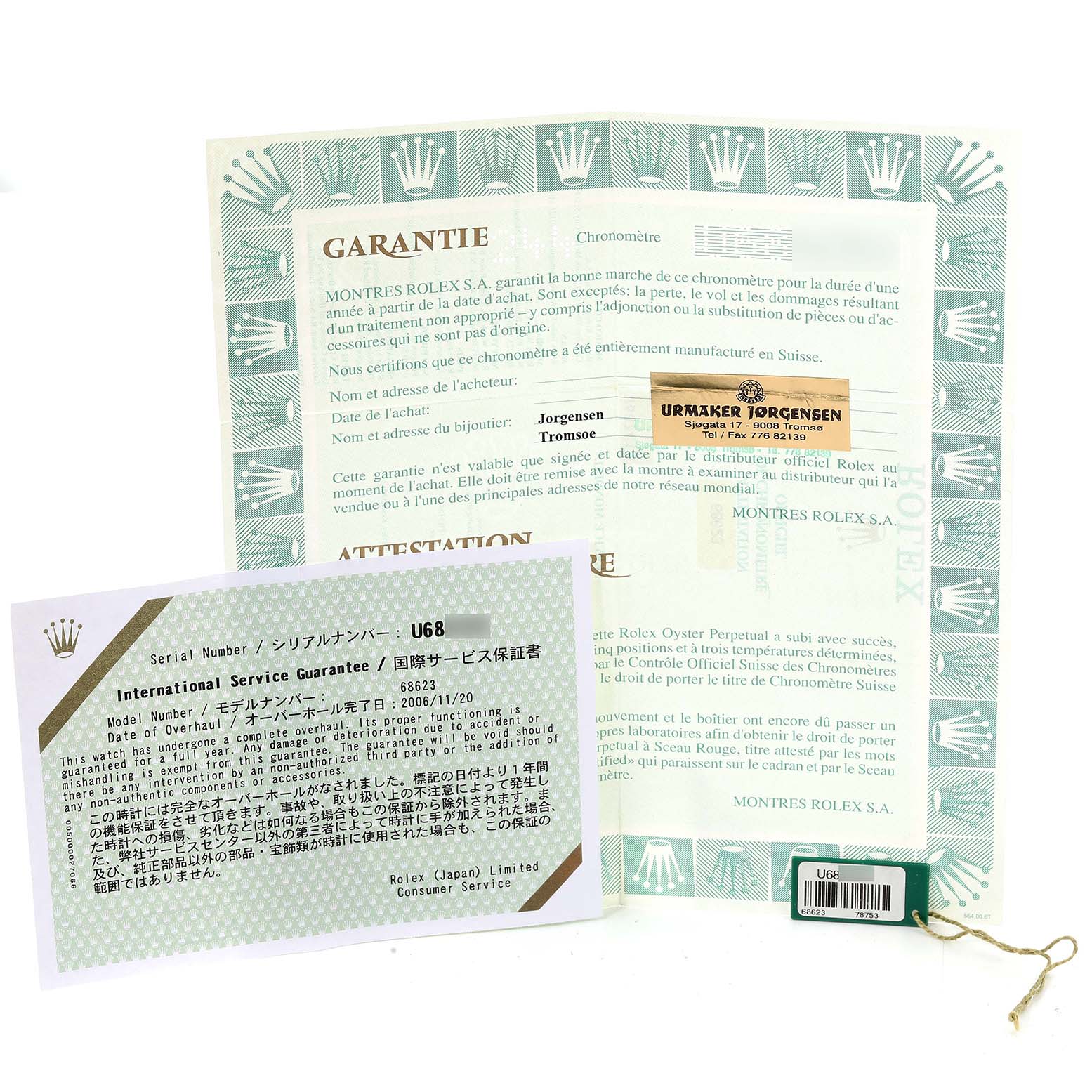 The image showcases the certification and warranty documents for a Rolex Yacht-Master 68623 Men's Steel and Gold (two tone) White Dial 68623 Men's Steel and Gold (two tone) White Dial model, along with a tag.