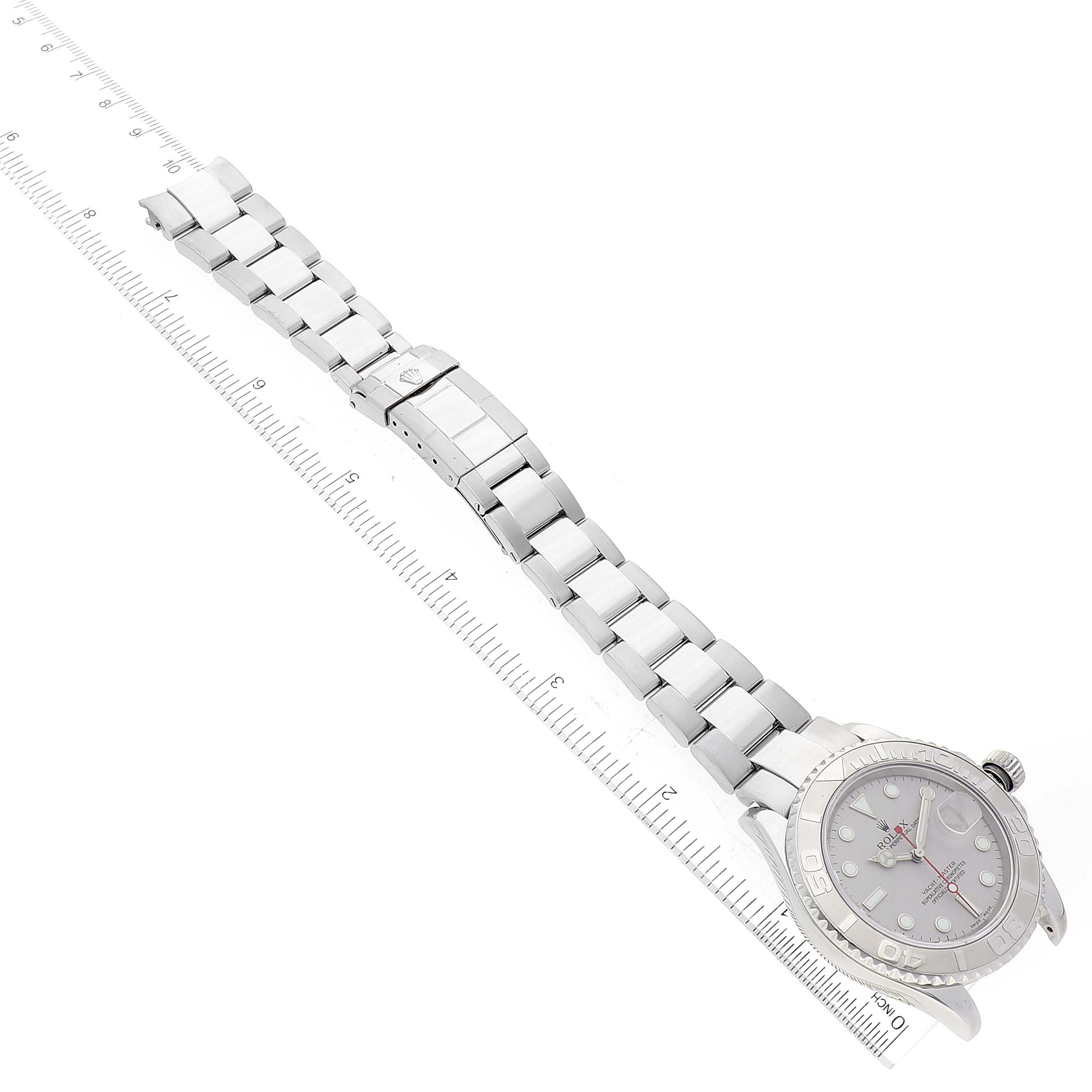 The image shows the top view of a Rolex Yacht-Master 16622 Men's Stainless Steel Silver Dial 16622 Men's Stainless Steel Silver Dial watch, displaying its full bracelet and face alongside a ruler for scale.