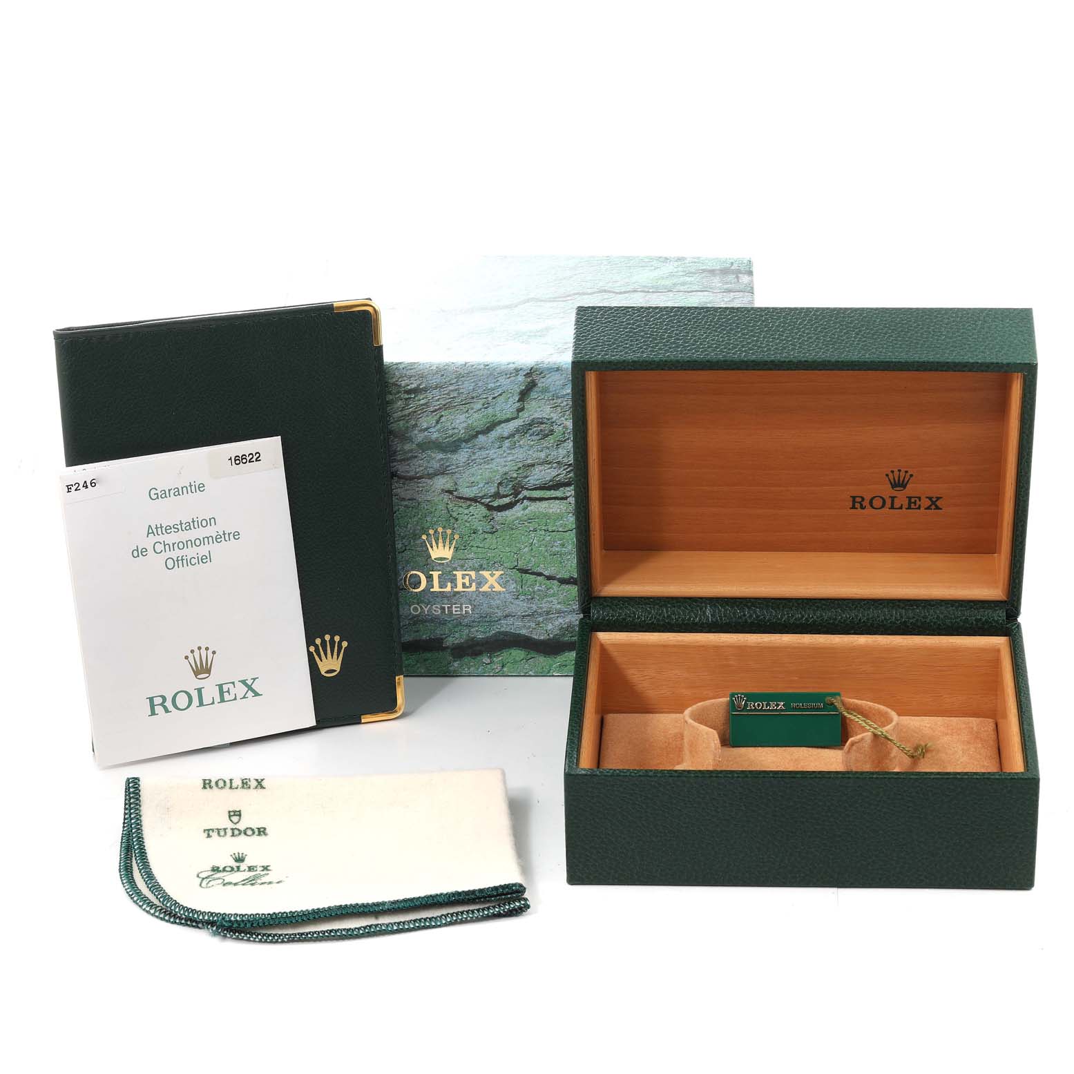 The image shows the packaging and accessories for the Rolex Yacht-Master 16622 Men's Stainless Steel Silver Dial 16622 Men's Stainless Steel Silver Dial, including the box, warranty card, booklet, and cleaning cloth.