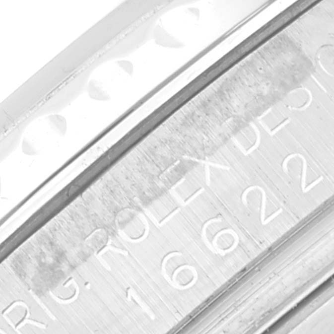 The image shows an extreme close-up of the engraved bezel and case edge of a Rolex Yacht-Master 16622 Men's Stainless Steel Silver Dial 16622 Men's Stainless Steel Silver Dial watch.