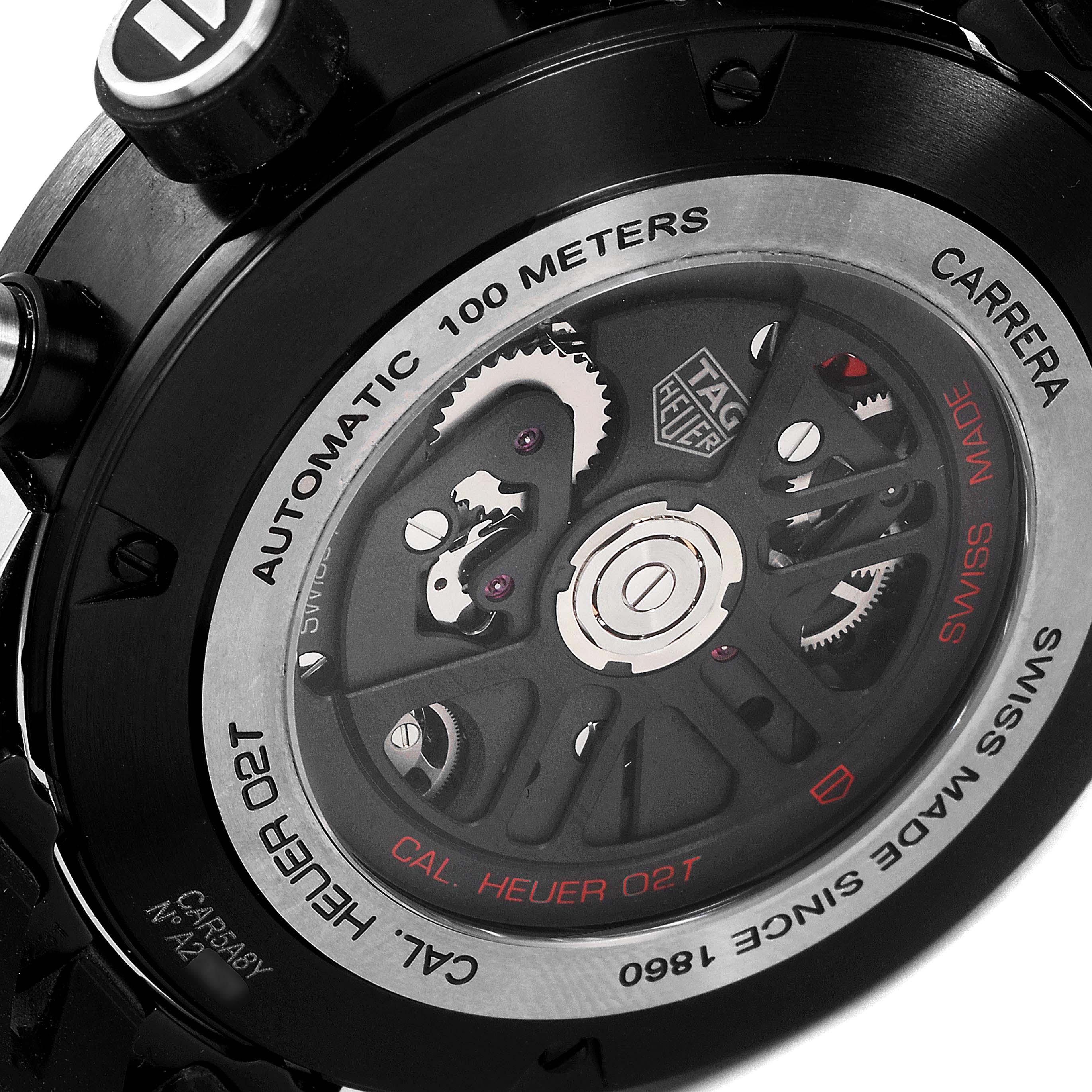 The image shows the back view of a Tag Heuer Carrera CAR5A8Y.FC6377 Men
s Titanium Black Dial CAR5A8Y.FC6377 Men
s Titanium Black Dial watch, highlighting the automatic movement and internal mechanism.