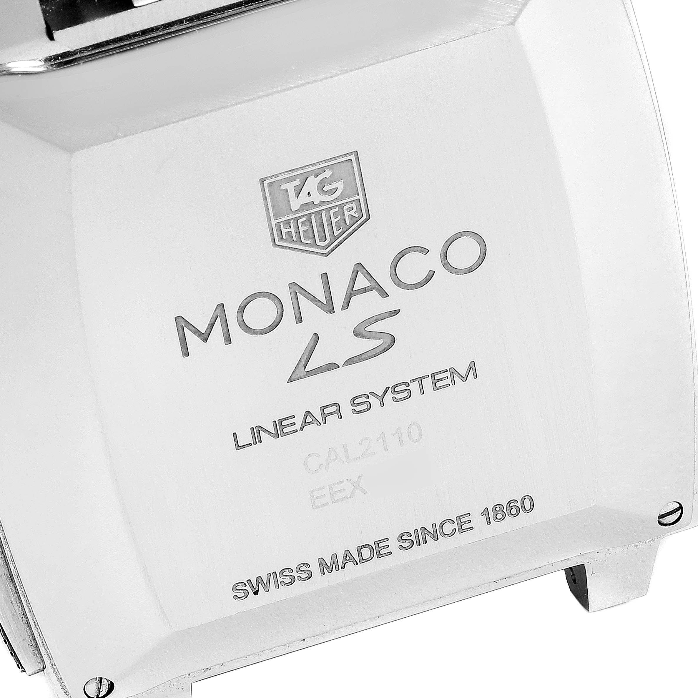 The image shows the case back of the Tag Heuer Monaco CAL2110.BA0781 Men's Stainless Steel Black Dial CAL2110.BA0781 Men's Stainless Steel Black Dial LS watch, highlighting the brand logo and model details.