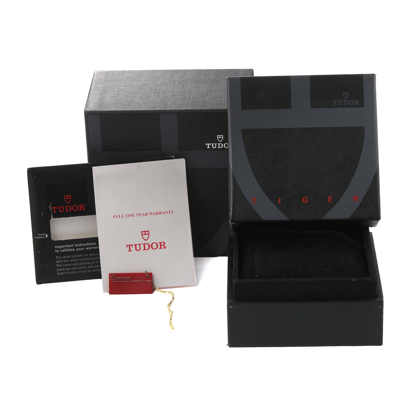 The image shows packaging accessories for the Tudor Prince model, including warranty cards and boxes, photographed from an angled view.