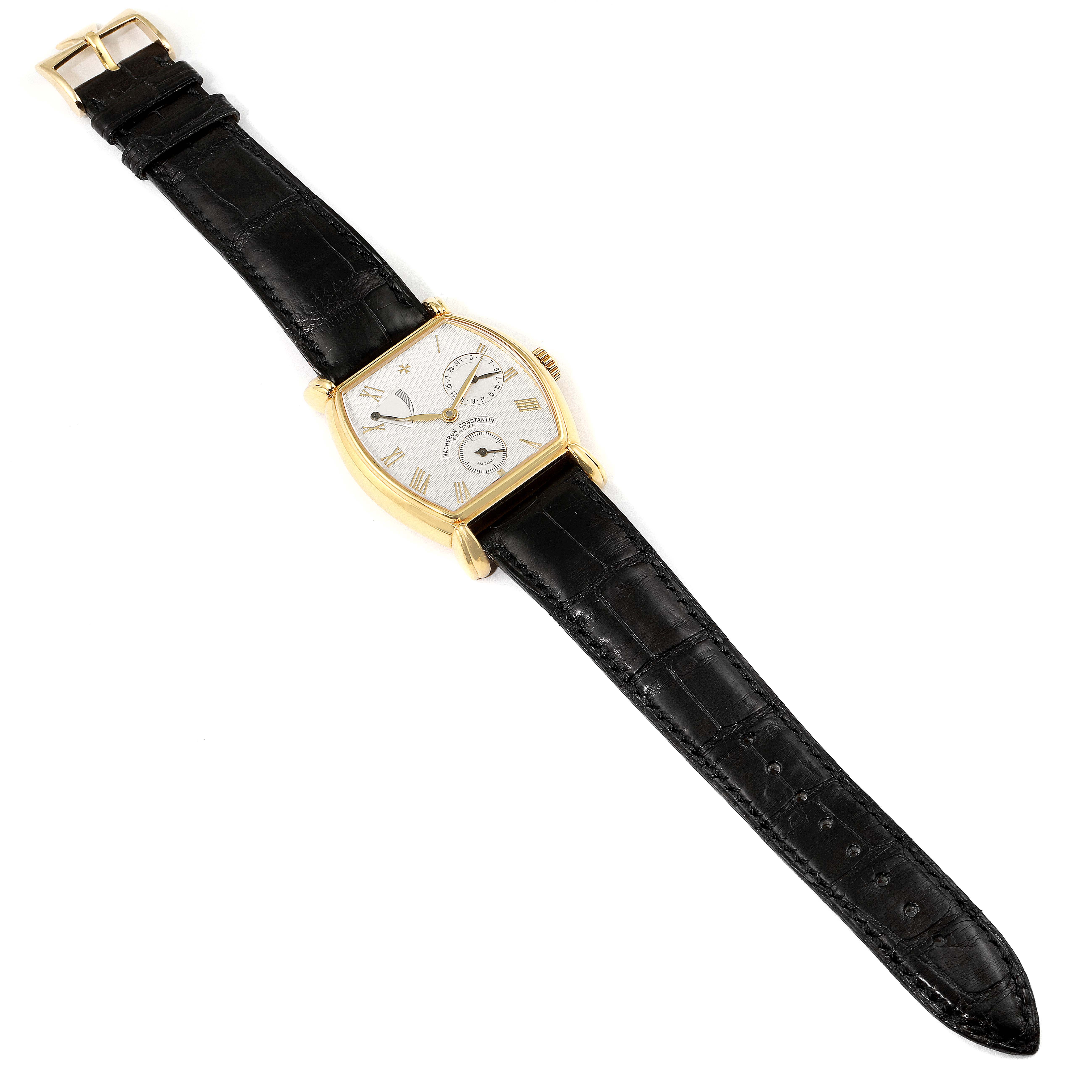 This image shows a top-down view of a Vintage Vacheron Constantin watch, displaying its dial, hands, case, and leather strap.