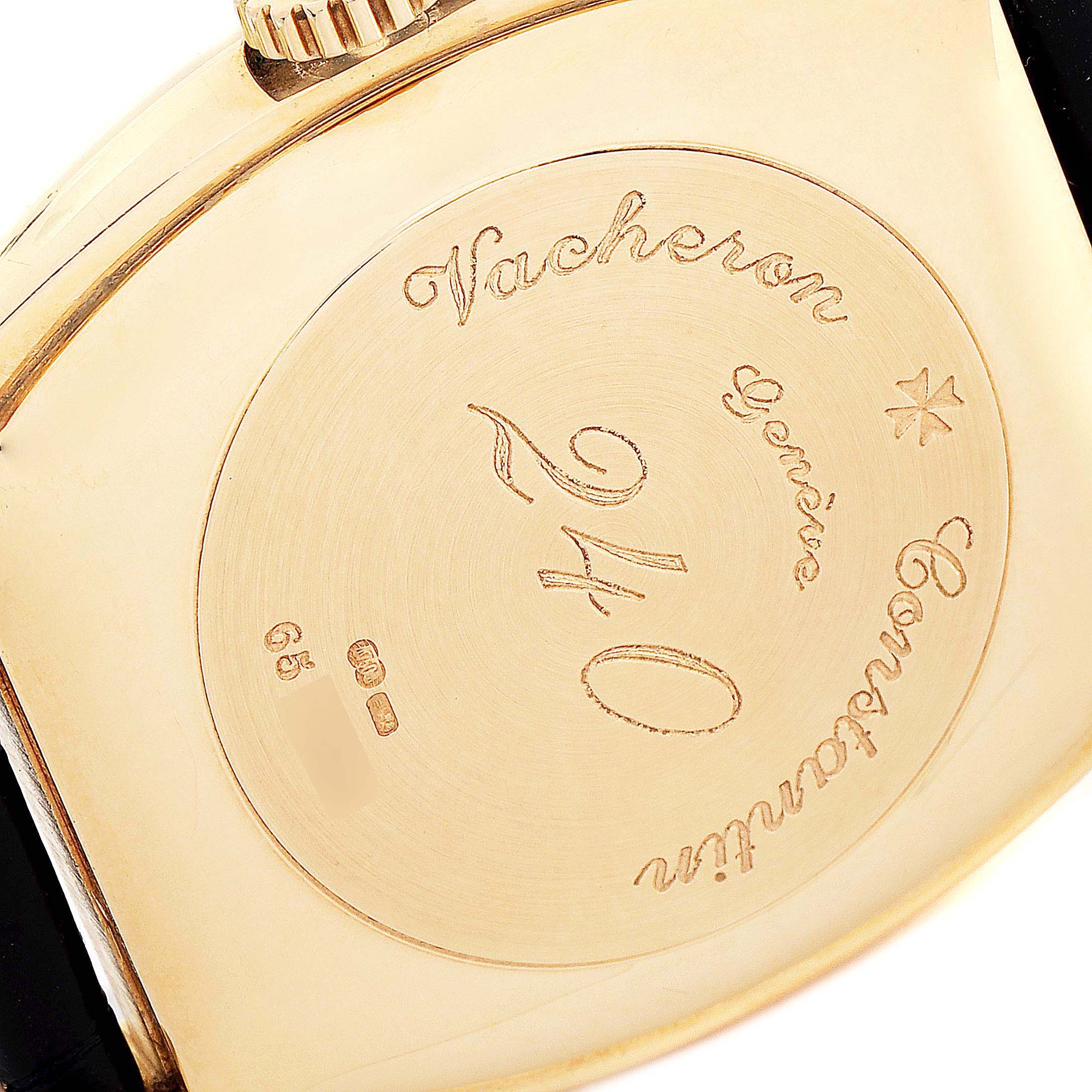 This image shows the engraved back case of a Vintage Vacheron Constantin watch from an overhead angle.