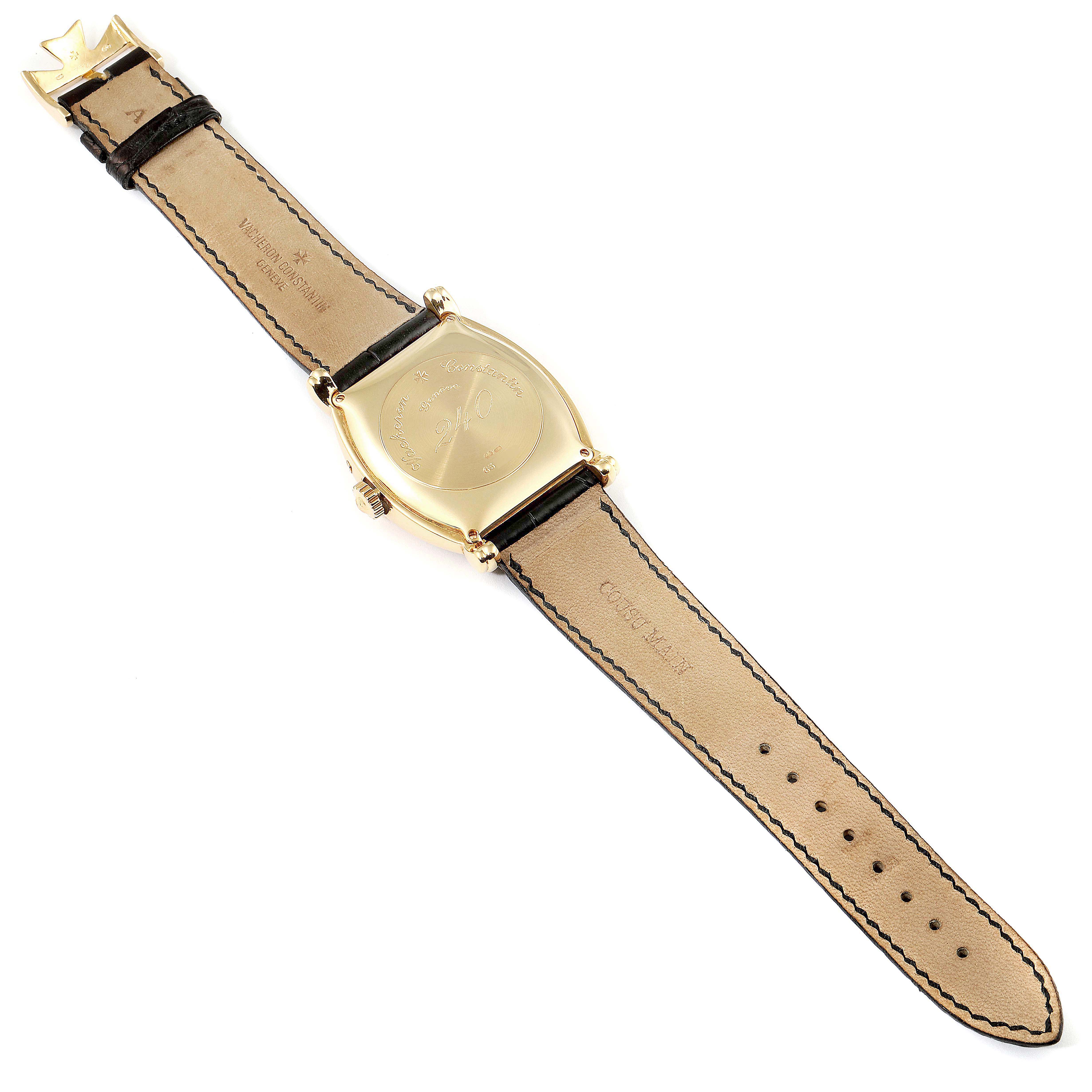 This image shows the backside of the Vintage Vacheron Constantin watch and its leather strap laid flat open.
