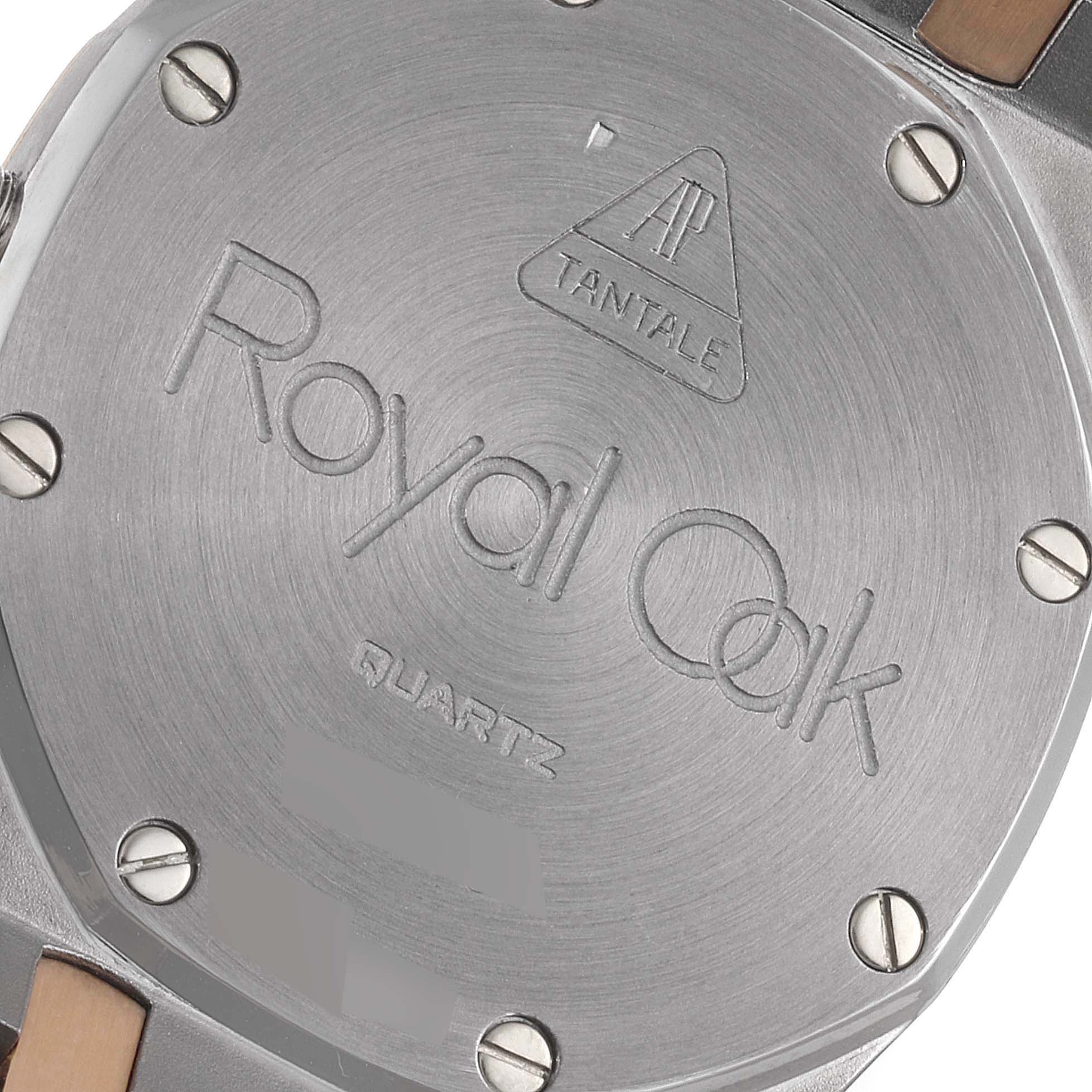 The image shows the back case of an Audemars Piguet Royal Oak 56175TR-OO-0789TR-01 Men's Steel and Gold (two tone) Black Dial 56175TR-OO-0789TR-01 Men's Steel and Gold (two tone) Black Dial watch, displaying the engraved logo and securing screws.