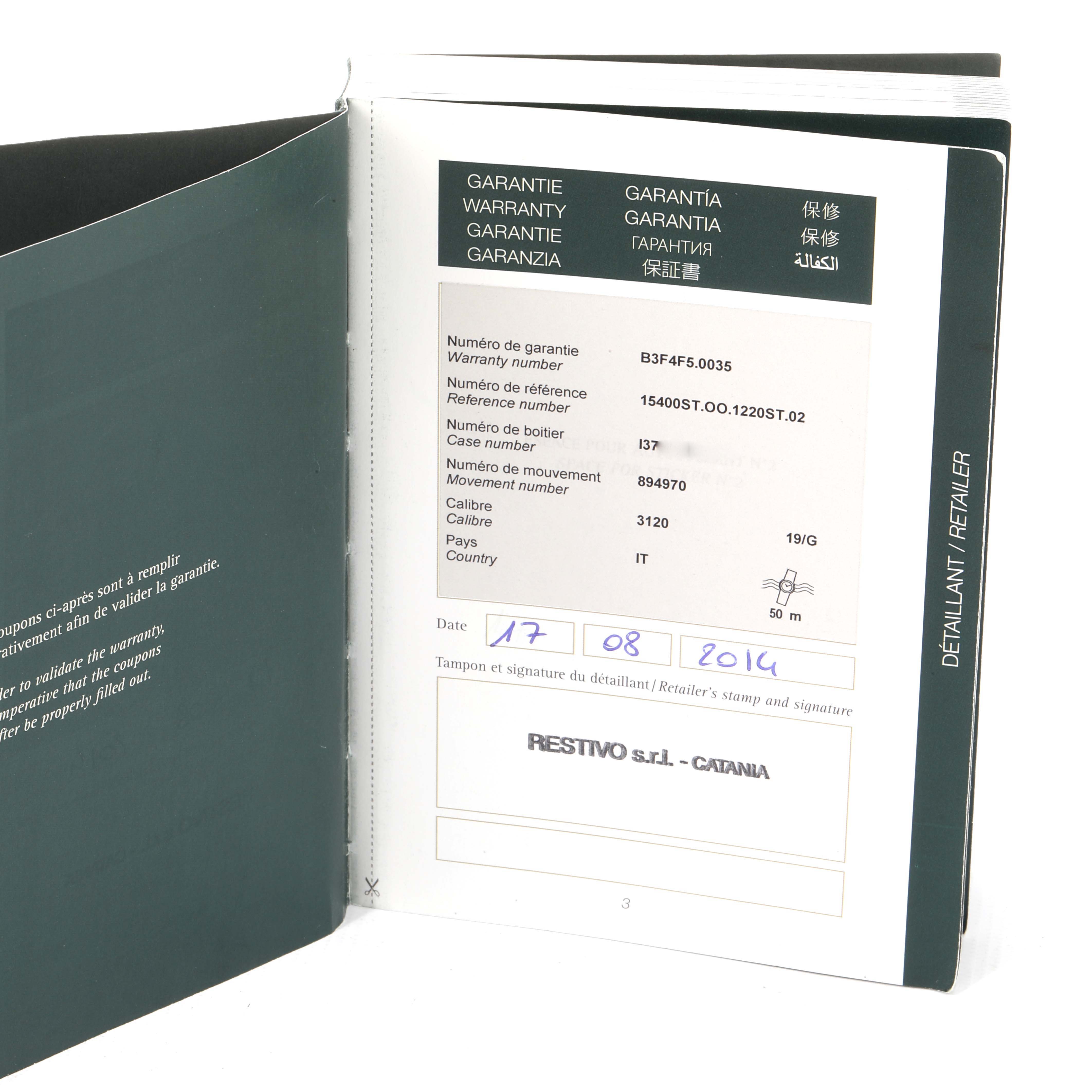 The image shows an open warranty booklet for the Royal Oak model by Audemars Piguet.