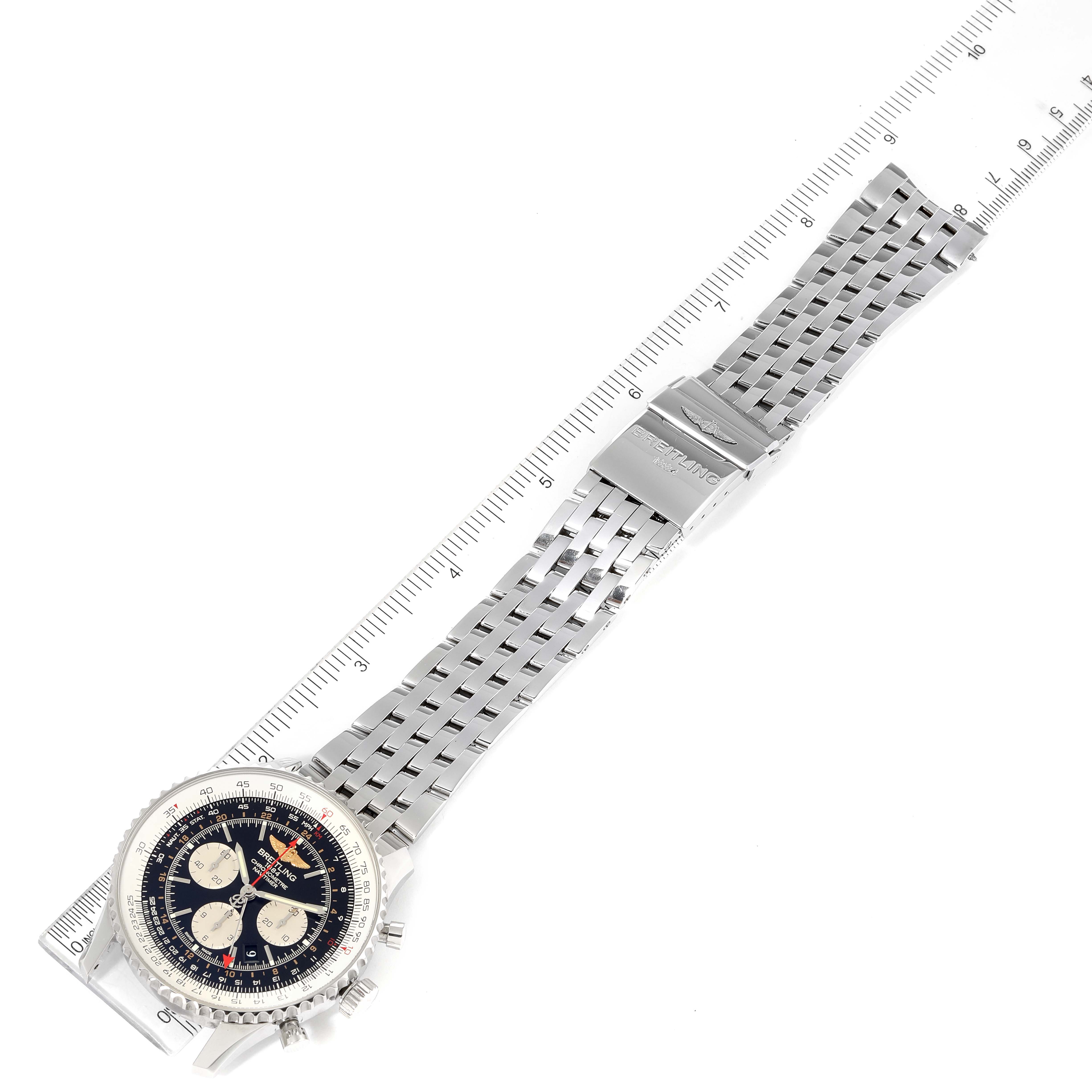 The image shows a Breitling Navitimer AB044121/BD24/443A Men's Stainless Steel Black Dial AB044121/BD24/443A Men's Stainless Steel Black Dial watch laid flat with a metal bracelet and ruler for scale.