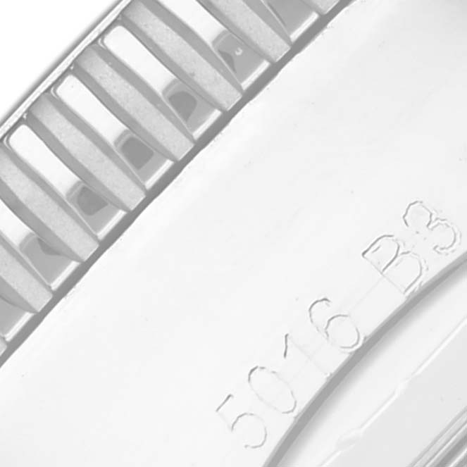 This image shows a close-up of the bezel and part of the case with an inscription on the Breitling Superocean U17320 Men's Steel and Gold (two tone) Black Dial U17320 Men's Steel and Gold (two tone) Black Dial model watch.