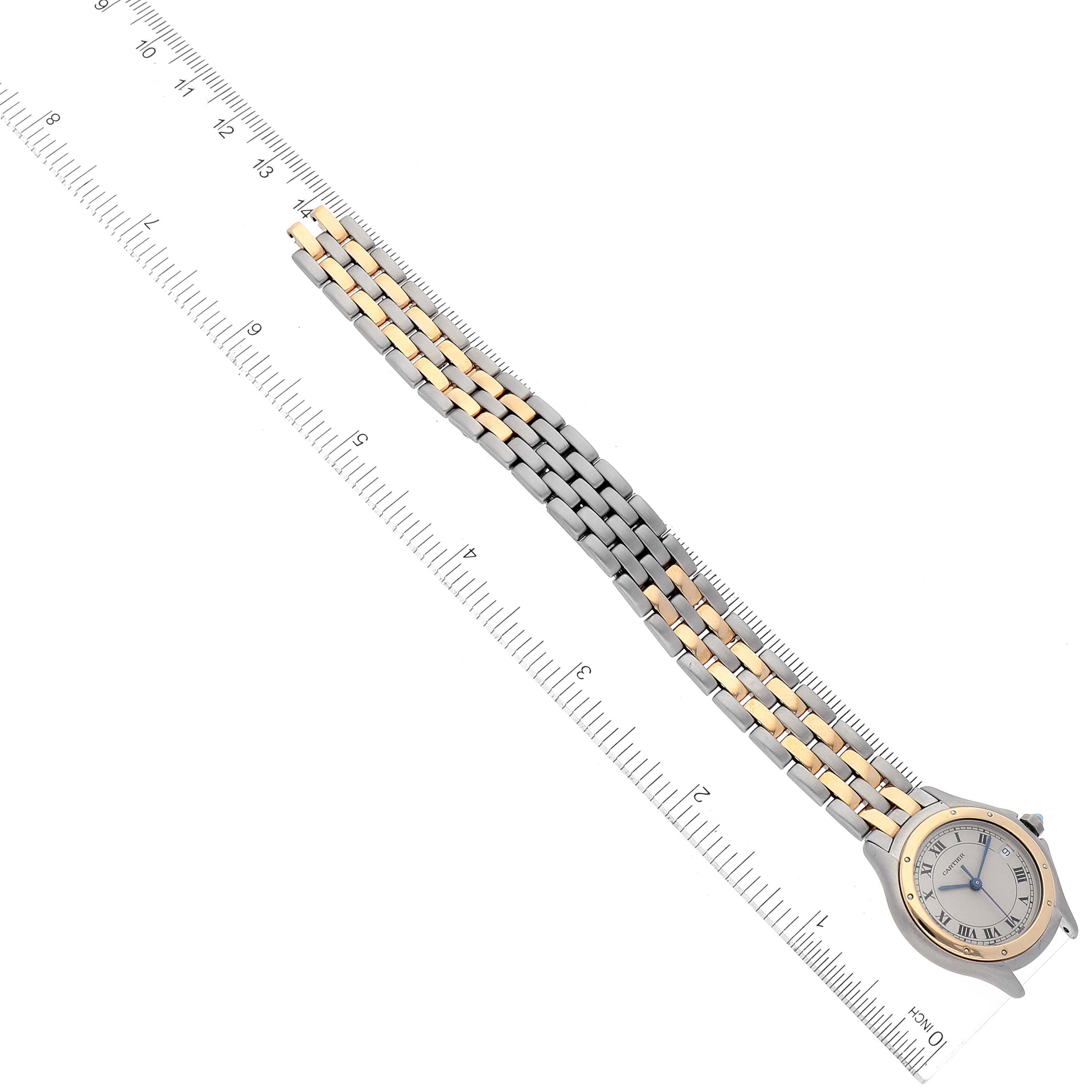 The image shows a Panthere model watch by Cartier, angled diagonally with the face and full bracelet visible alongside a ruler for scale.