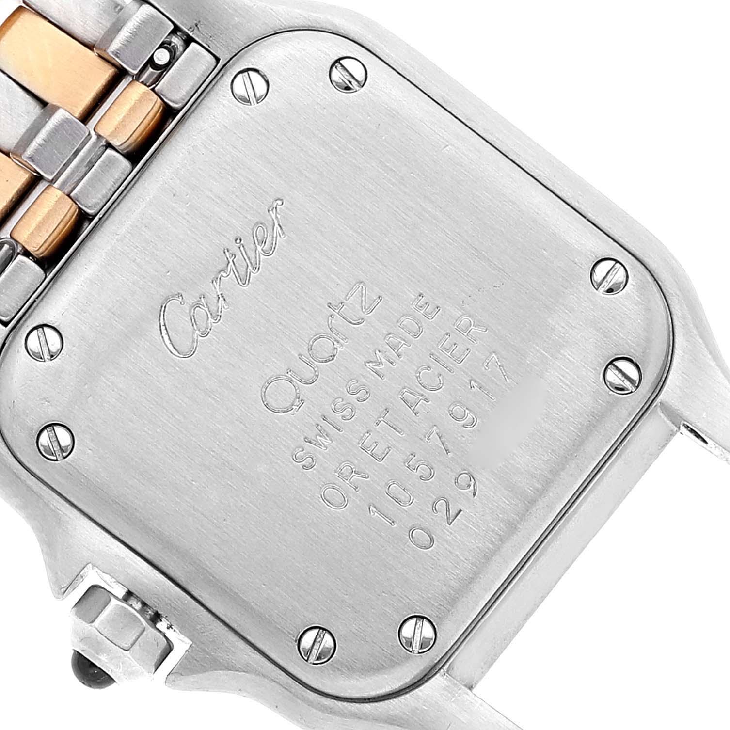 This image shows the case back of a Cartier Panthere W25029B6 Women's Steel and Gold (two tone) Silver Dial W25029B6 Women's Steel and Gold (two tone) Silver Dial model watch, highlighting its screws, engraving, and part of the band.