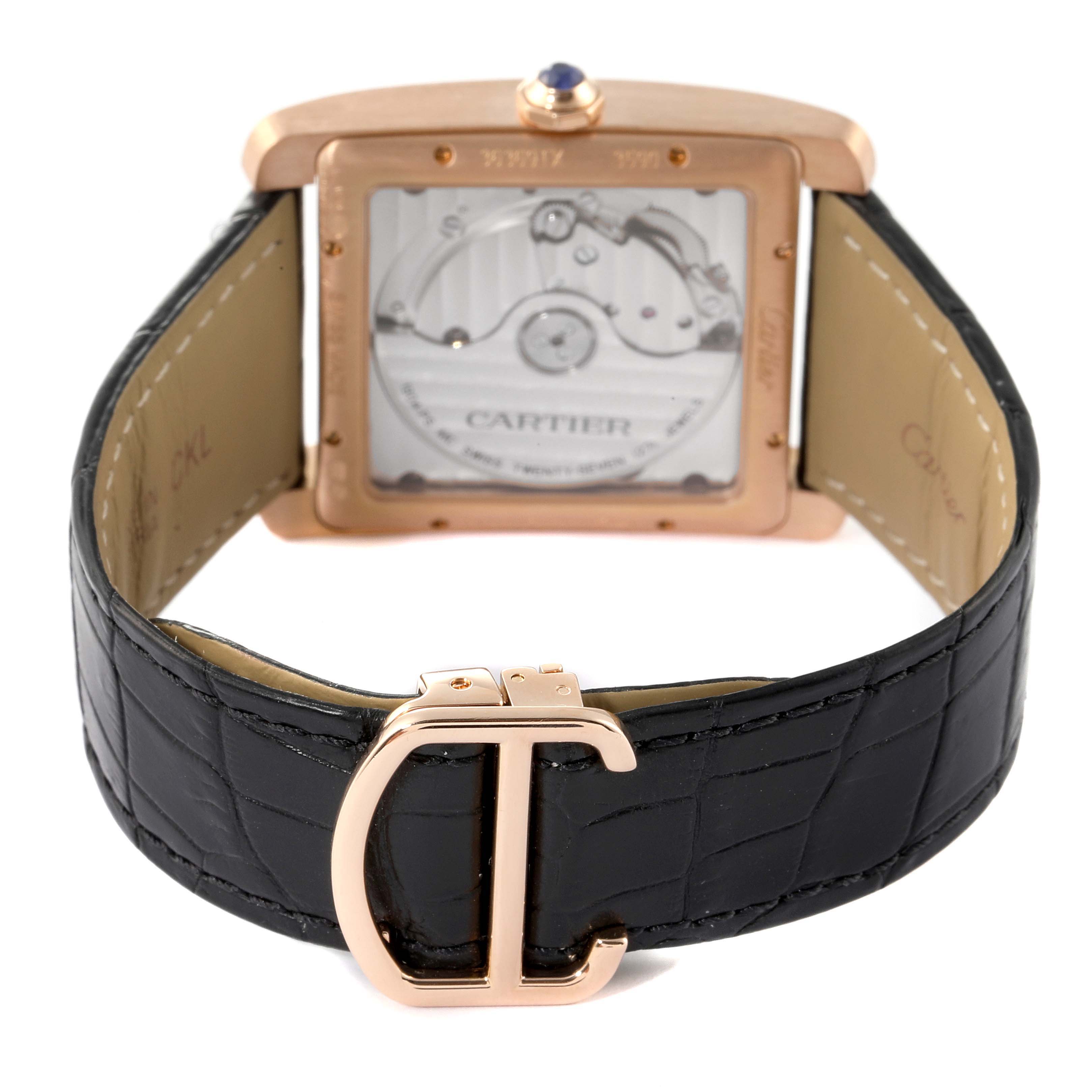 The image shows the back view of a Cartier Tank MC W5330001 Men's Rose Gold Silver Dial W5330001 Men's Rose Gold Silver Dial watch, highlighting its transparent case back and black leather strap with a Cartier clasp.