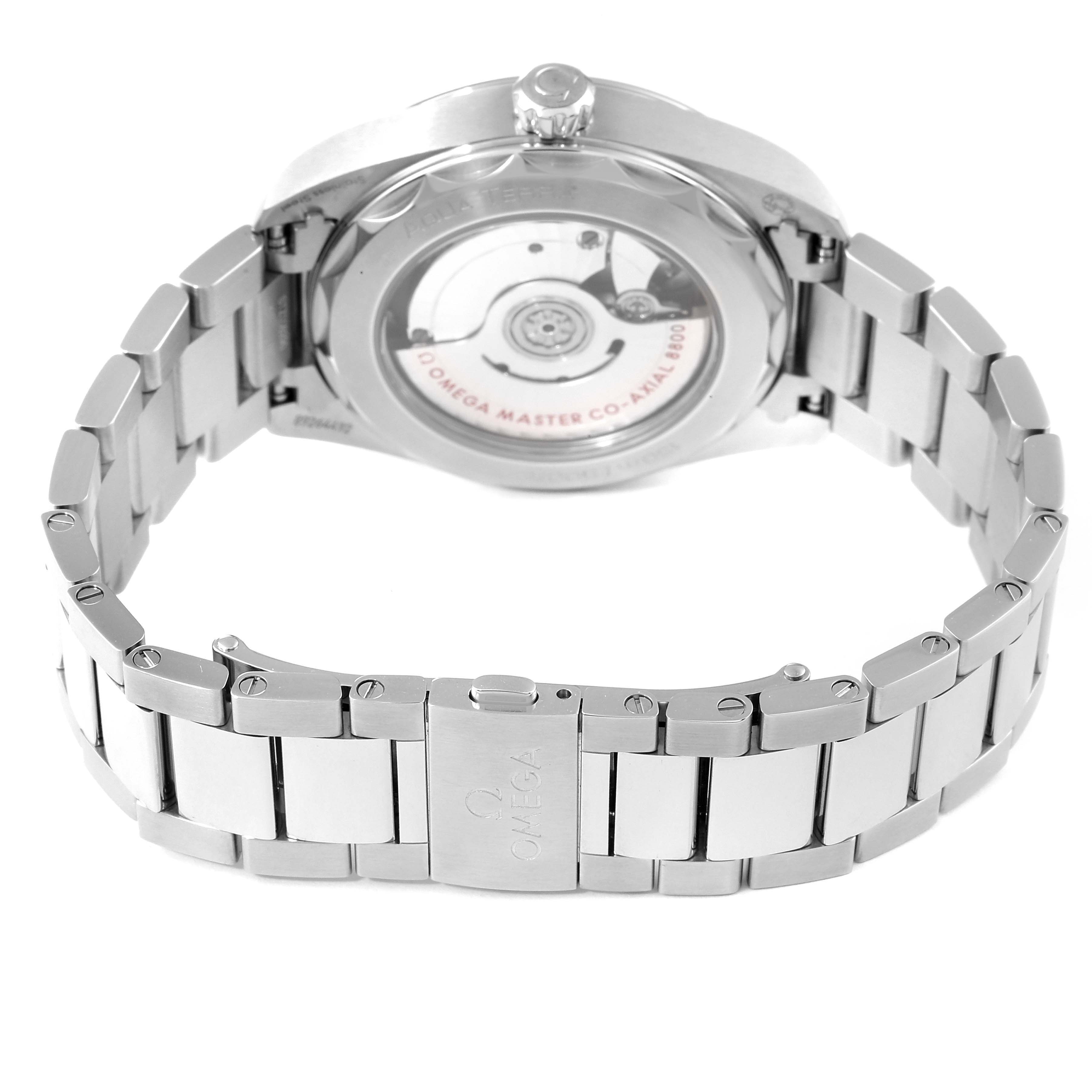 The image shows the back view of the Omega Aqua Terra 220.10.38.20.01.001 Men's Stainless Steel Black Dial 220.10.38.20.01.001 Men's Stainless Steel Black Dial watch, displaying its movement and stainless steel bracelet.