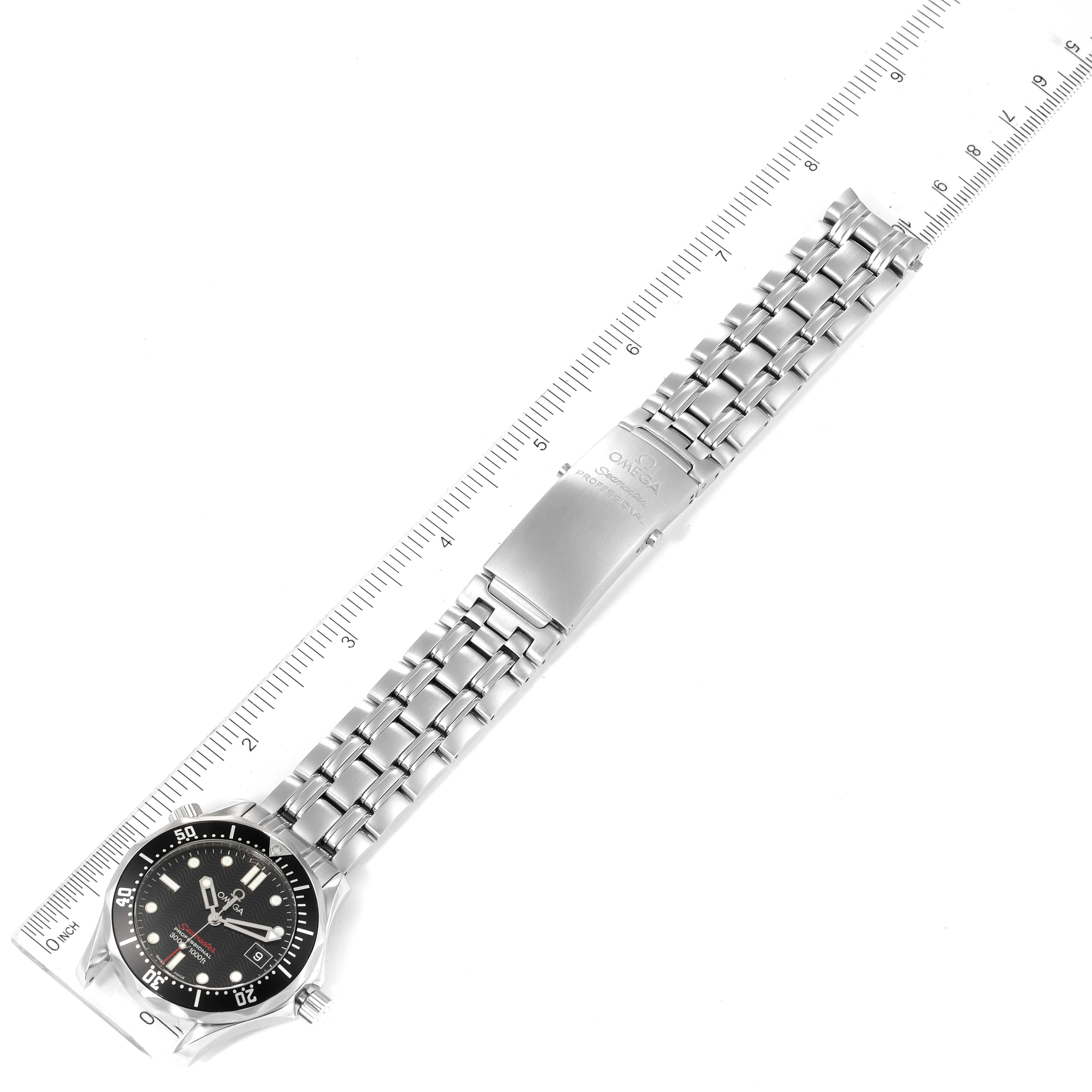 The image shows an Omega Seamaster 212.30.36.61.01.001 Men's Stainless Steel Black Dial 212.30.36.61.01.001 Men's Stainless Steel Black Dial watch laid flat with a ruler measuring its bracelet.