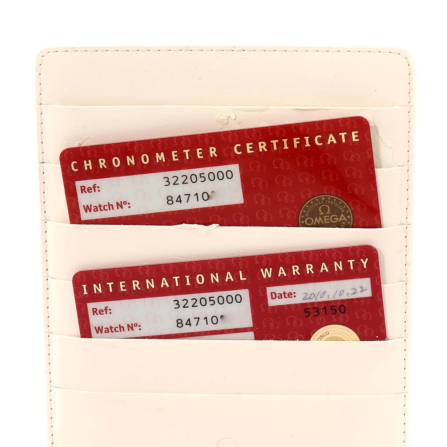 This image shows the chronometer certificate and international warranty cards for an Omega Speedmaster 3220.50.00 Men
s Stainless Steel Black Dial 3220.50.00 Men
s Stainless Steel Black Dial watch inside a holder.