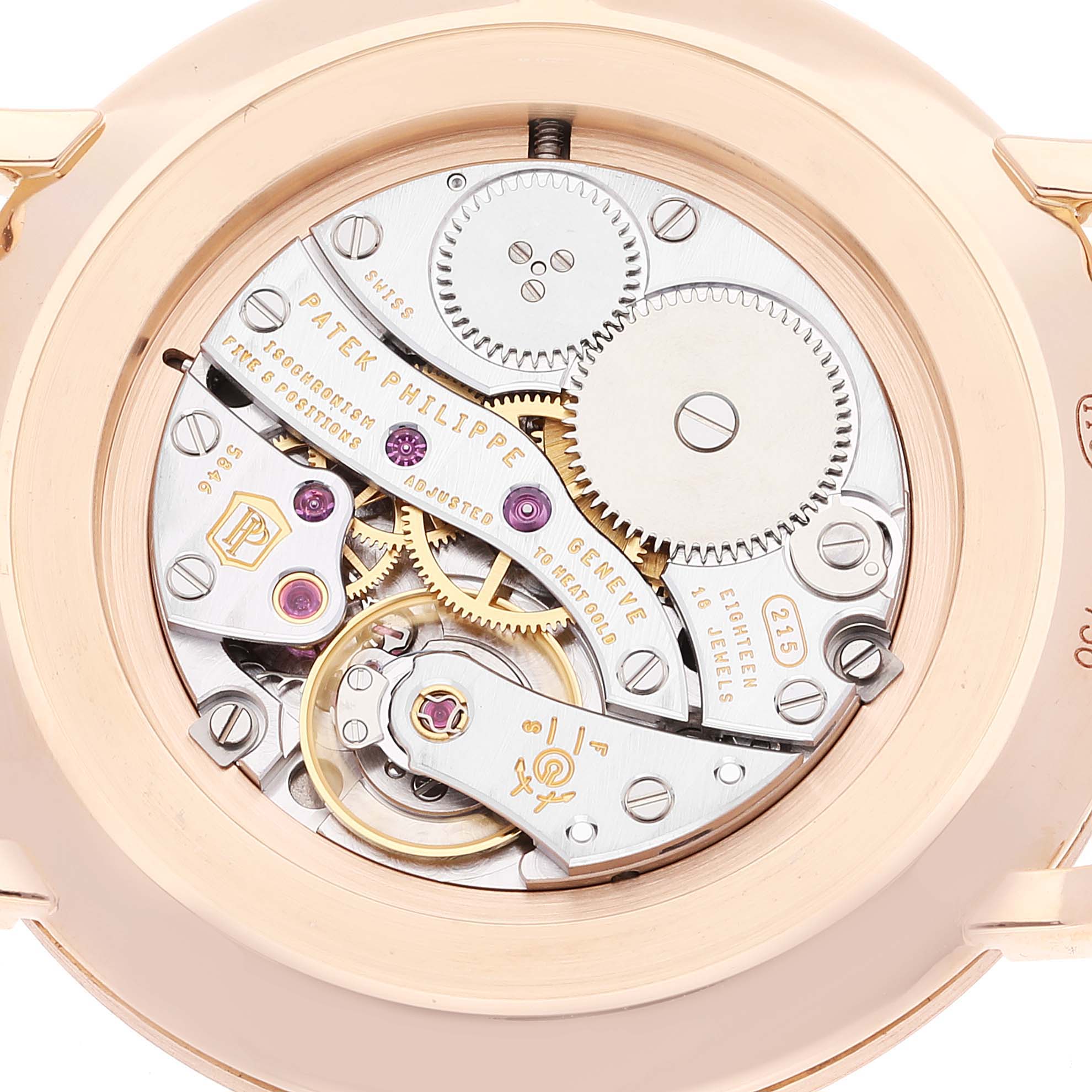 The image shows the back view of the Patek Philippe Calatrava 5119R Men's Rose Gold White Dial 5119R Men's Rose Gold White Dial watch, highlighting its intricate mechanical movement components.