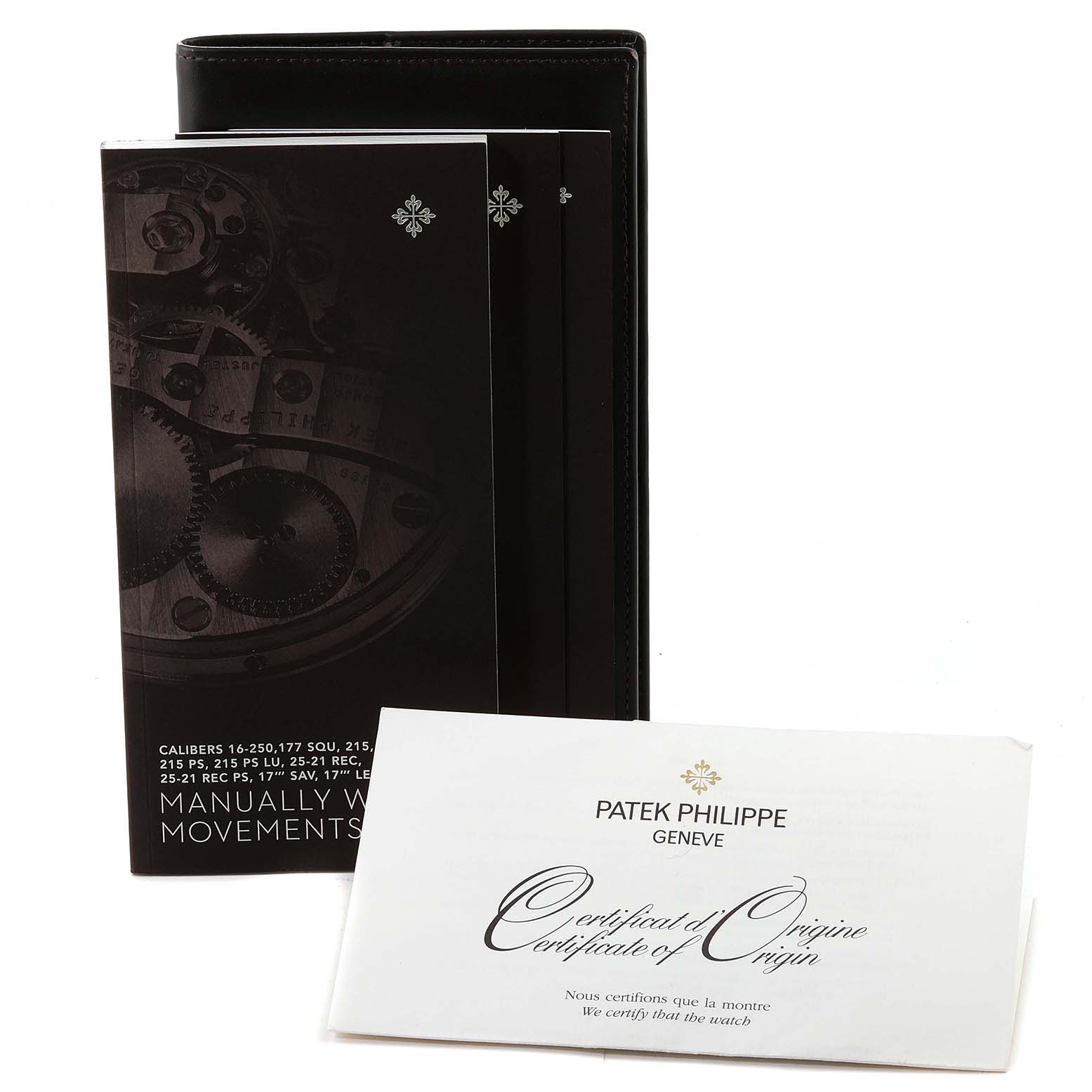 The image shows the manual and Certificate of Origin for a Patek Philippe Calatrava 4897G-001 Women's White Gold Blue Dial 4897G-001 Women's White Gold Blue Dial watch from a front angle.