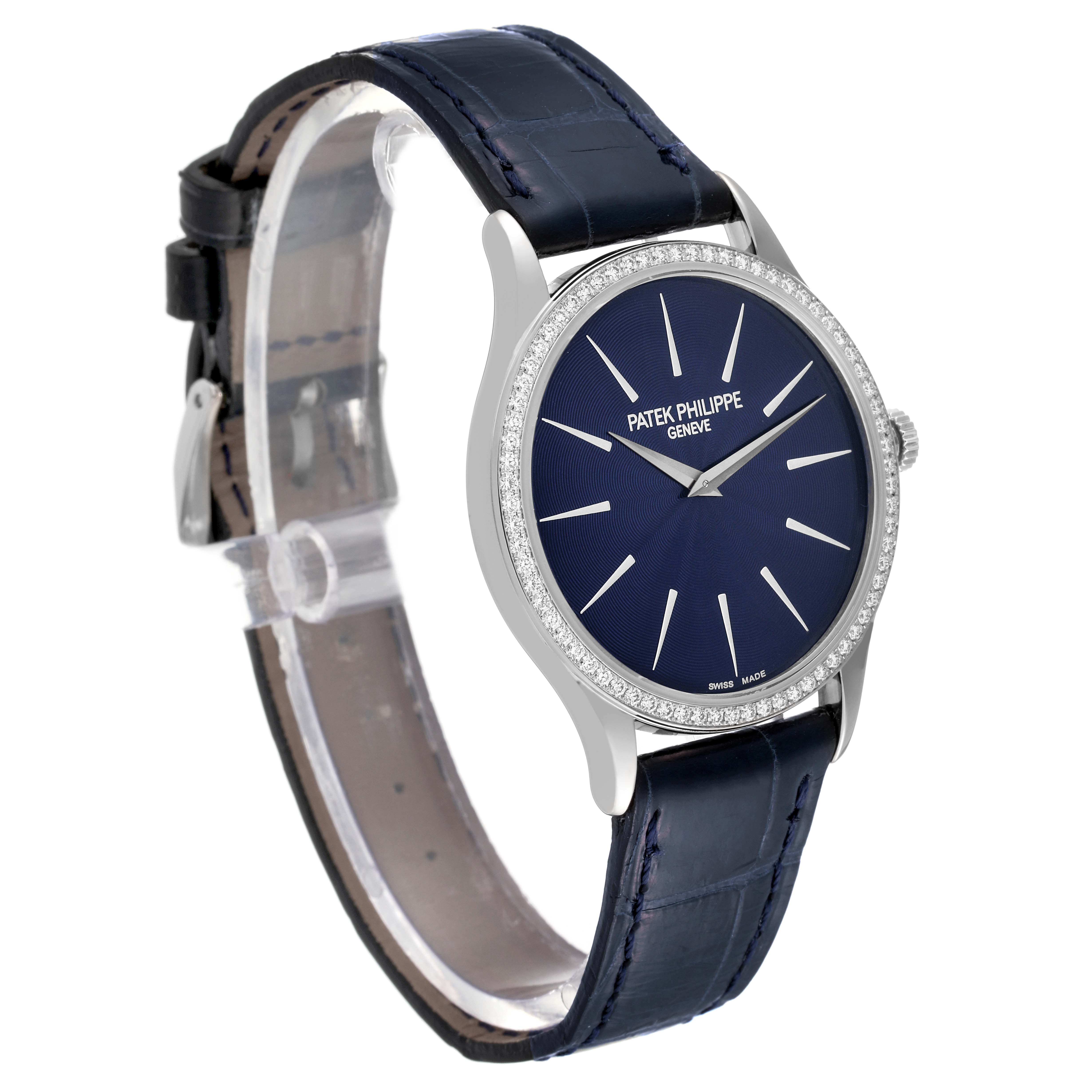 The Patek Philippe Calatrava 4897G-001 Women's White Gold Blue Dial 4897G-001 Women's White Gold Blue Dial watch is shown from a front angle, highlighting the blue dial, diamond bezel, and leather strap.