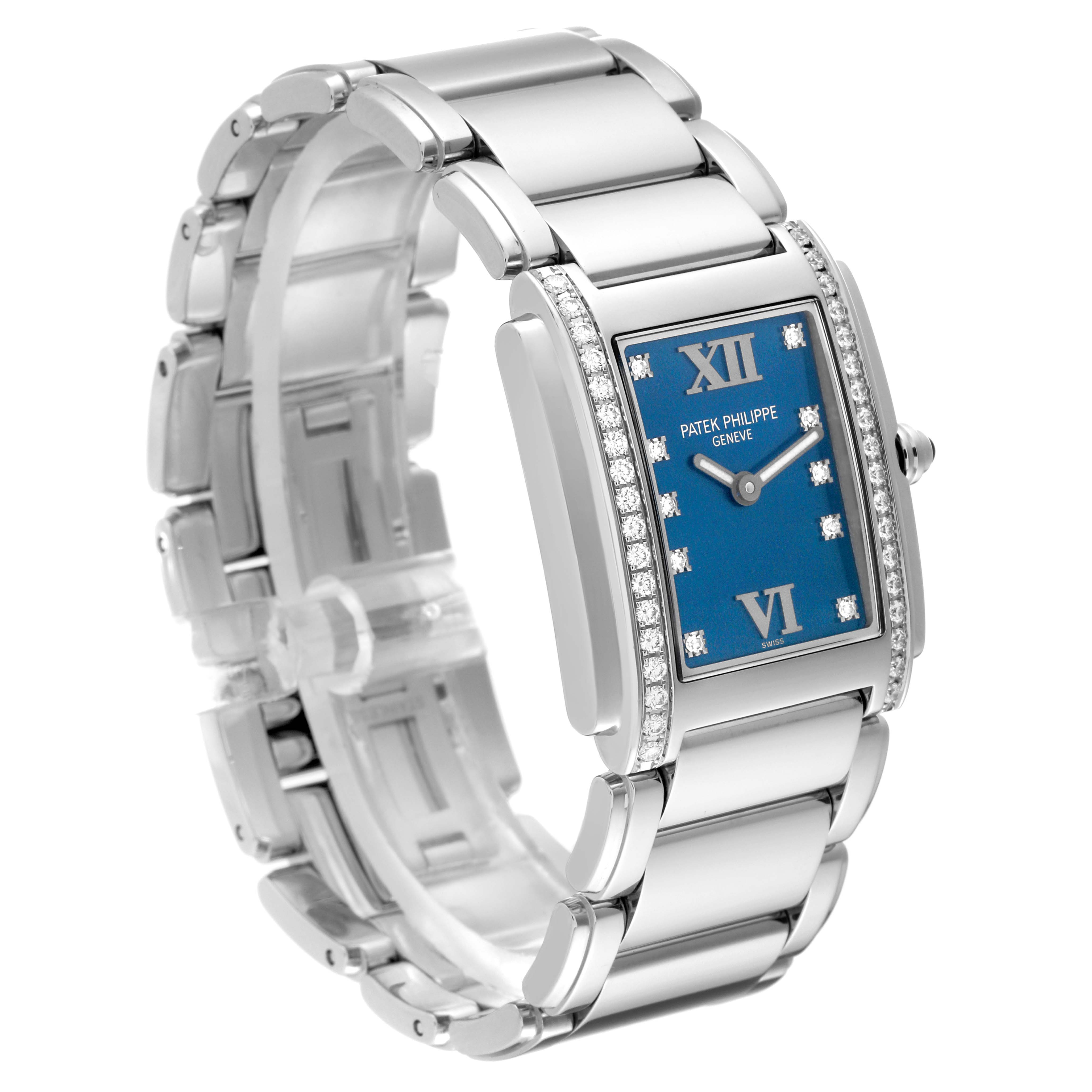 The image shows a side angle of the Patek Philippe Twenty-4 4910/10A-012 Women's Stainless Steel Blue Dial 4910/10A-012 Women's Stainless Steel Blue Dial watch, highlighting the bracelet, blue dial, and diamond-set bezel.