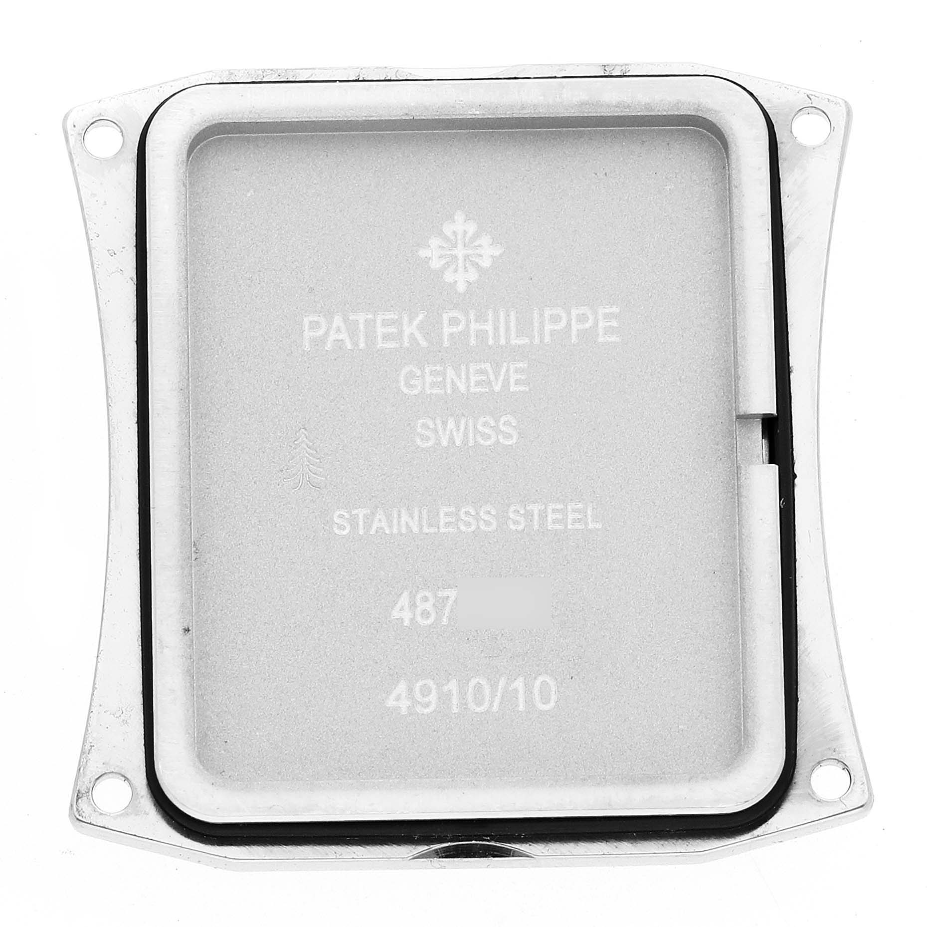 This image shows the back casing of the Patek Philippe Twenty-4 4910/10A-012 Women's Stainless Steel Blue Dial 4910/10A-012 Women's Stainless Steel Blue Dial model watch, showing inscriptions and material details.